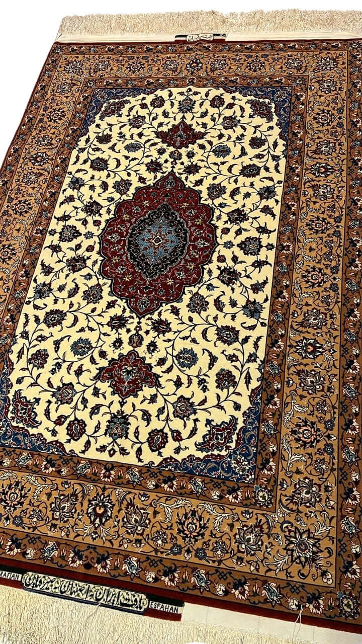 "Close-up of a Seirafian floral Persian rug by Ali Reza Seirafian, highlighting the central medallion and delicate floral motifs in natural dyes."

