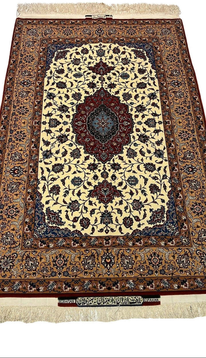 "Hand-knotted Seirafian floral rug by Ali Reza Seirafian, featuring intricate floral designs in burgundy, beige, and blue, crafted from silk and wool in Isfahan."

