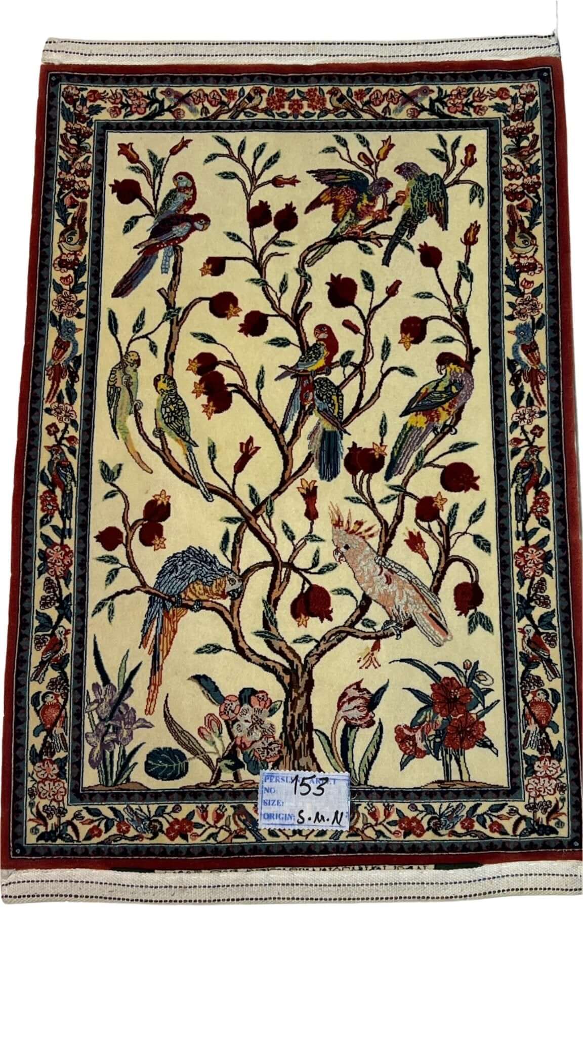 Luxury Isfahan rug by Karim Seirafian featuring pomegranates and colorful birds.
