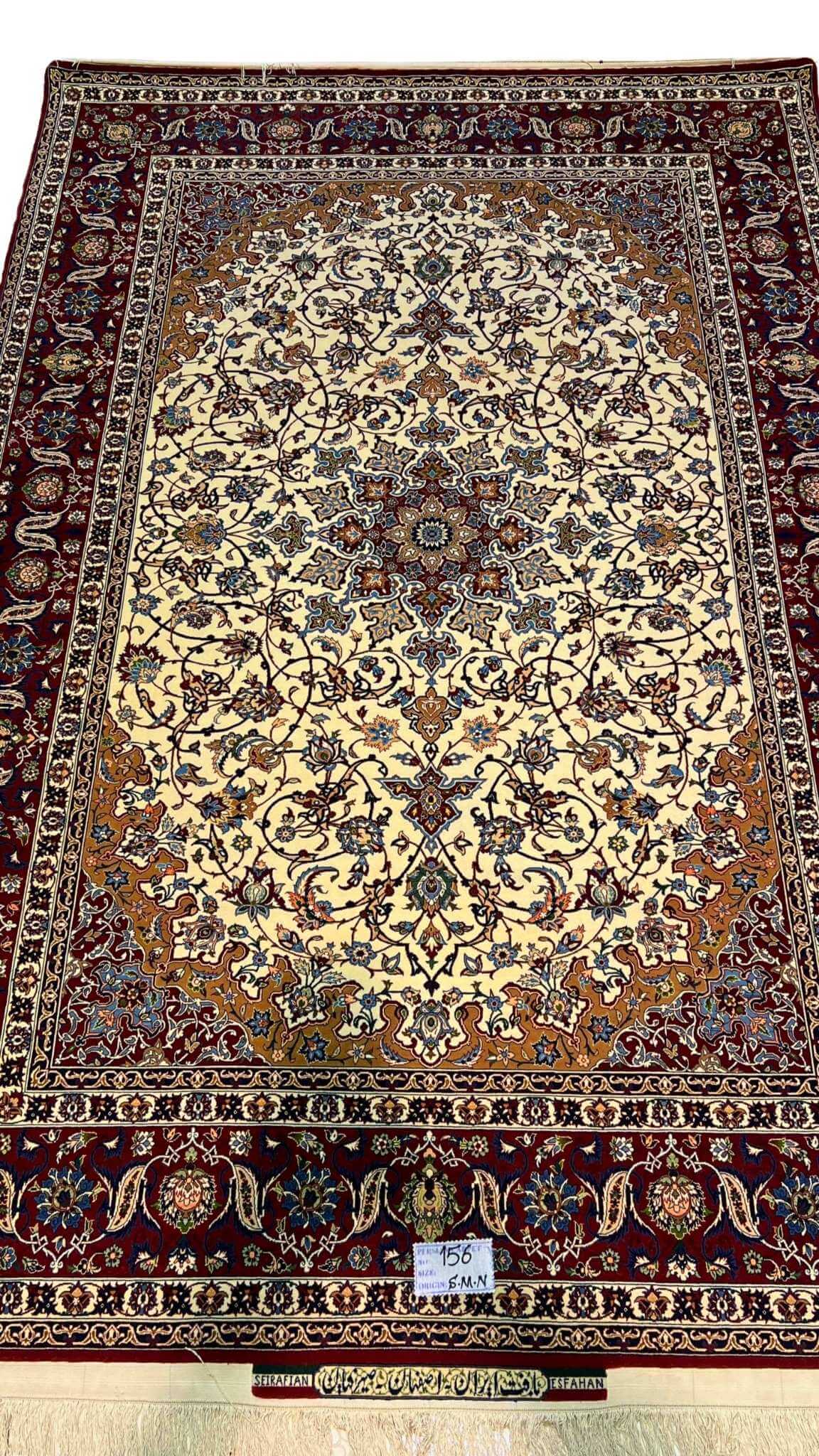 "Hand-knotted Isfahan rug by Seirafian featuring a medallion design with floral motifs."
