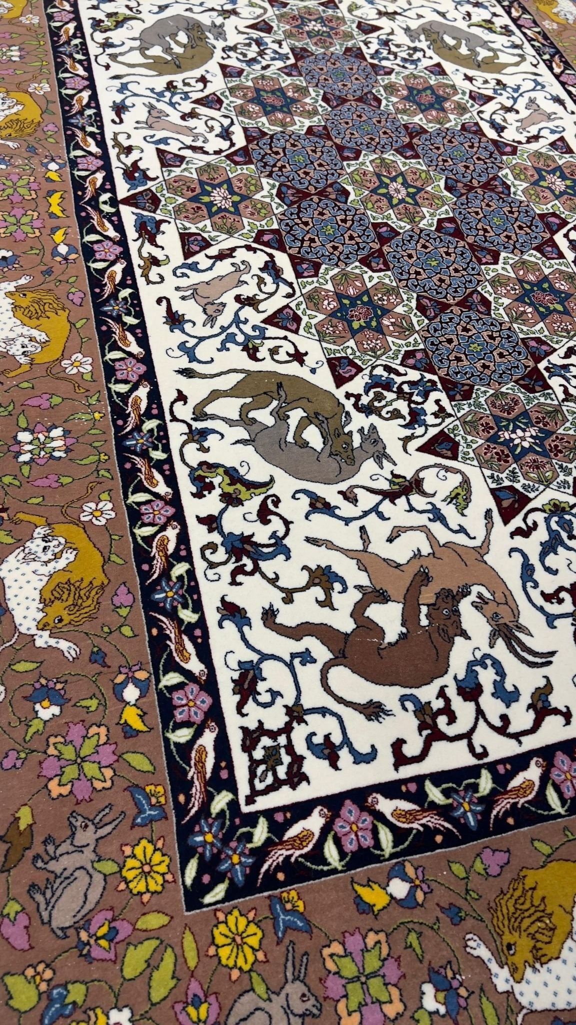 High-knot density Seirafian carpet in warm tones and detailed patterns.
