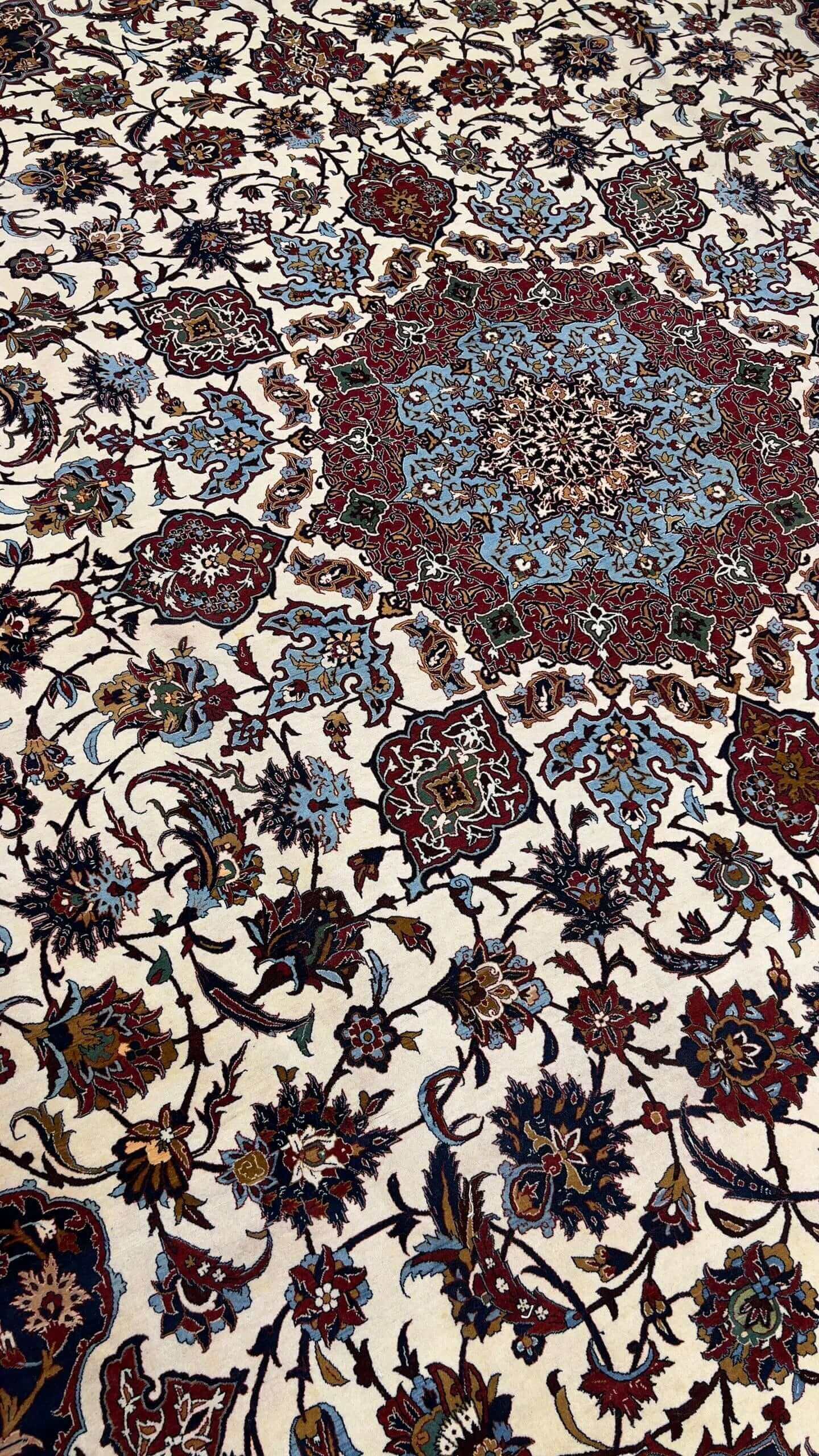 "Vintage Seirafian rug, hand-knotted in Isfahan, Iran, with a 45-year-old heritage."
