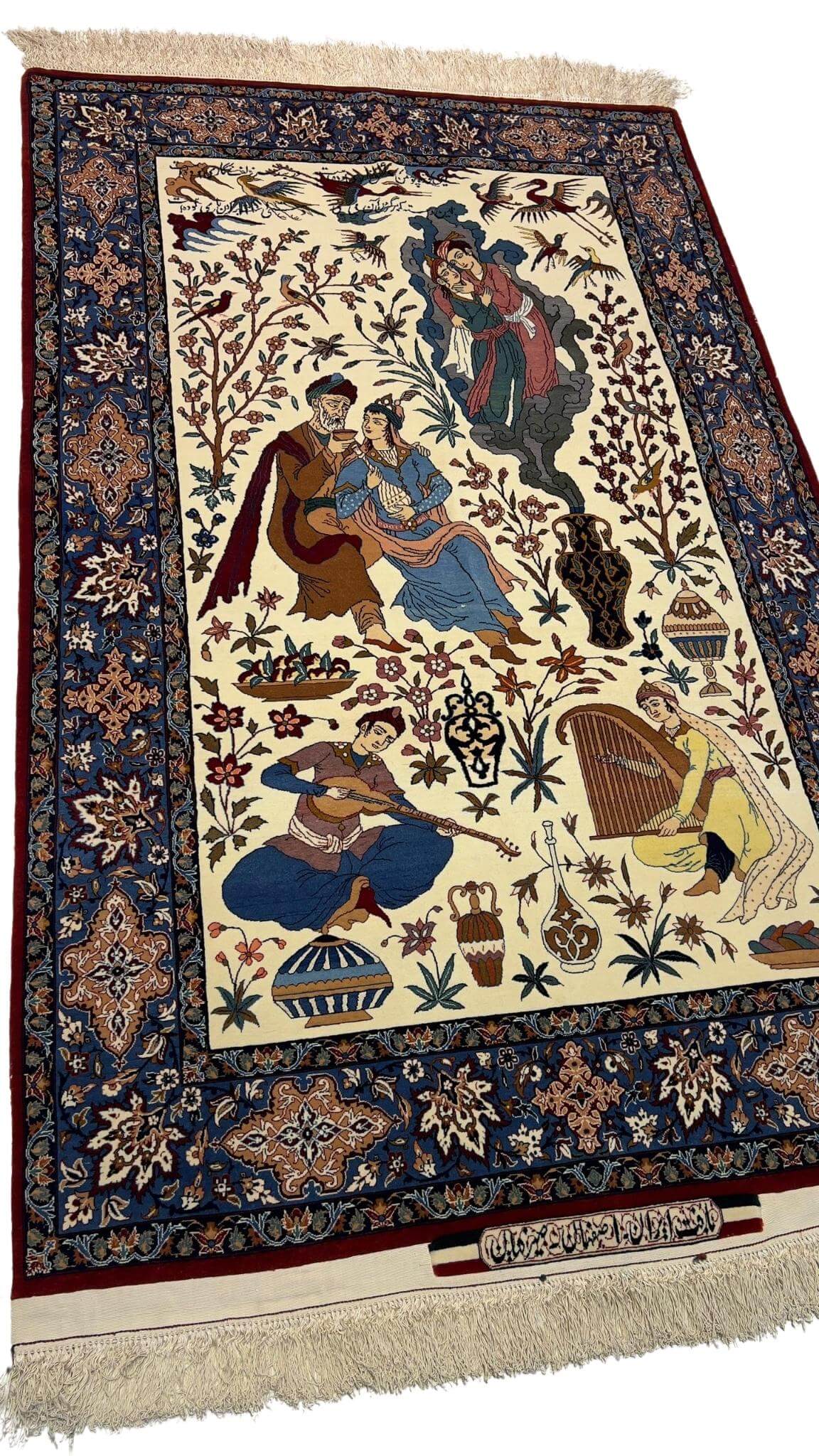 Detailed view of motifs on a silk and wool Hassan Seirafian rug, featuring natural-dyed colors.
