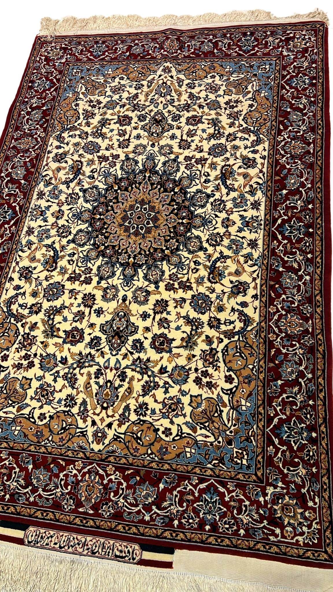 "Exquisite Isfahan Seirafian rug in shades of beige and burgundy, handwoven with wool and silk for luxury and durability."

