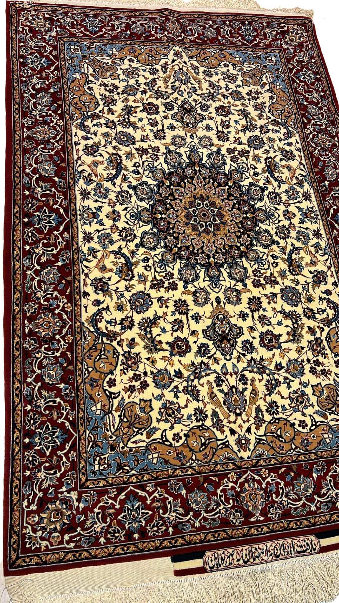 "Detailed Persian Seirafian rug with a classic medallion design, crafted from naturally dyed wool and silk by Master Ahmad Seirafian."

