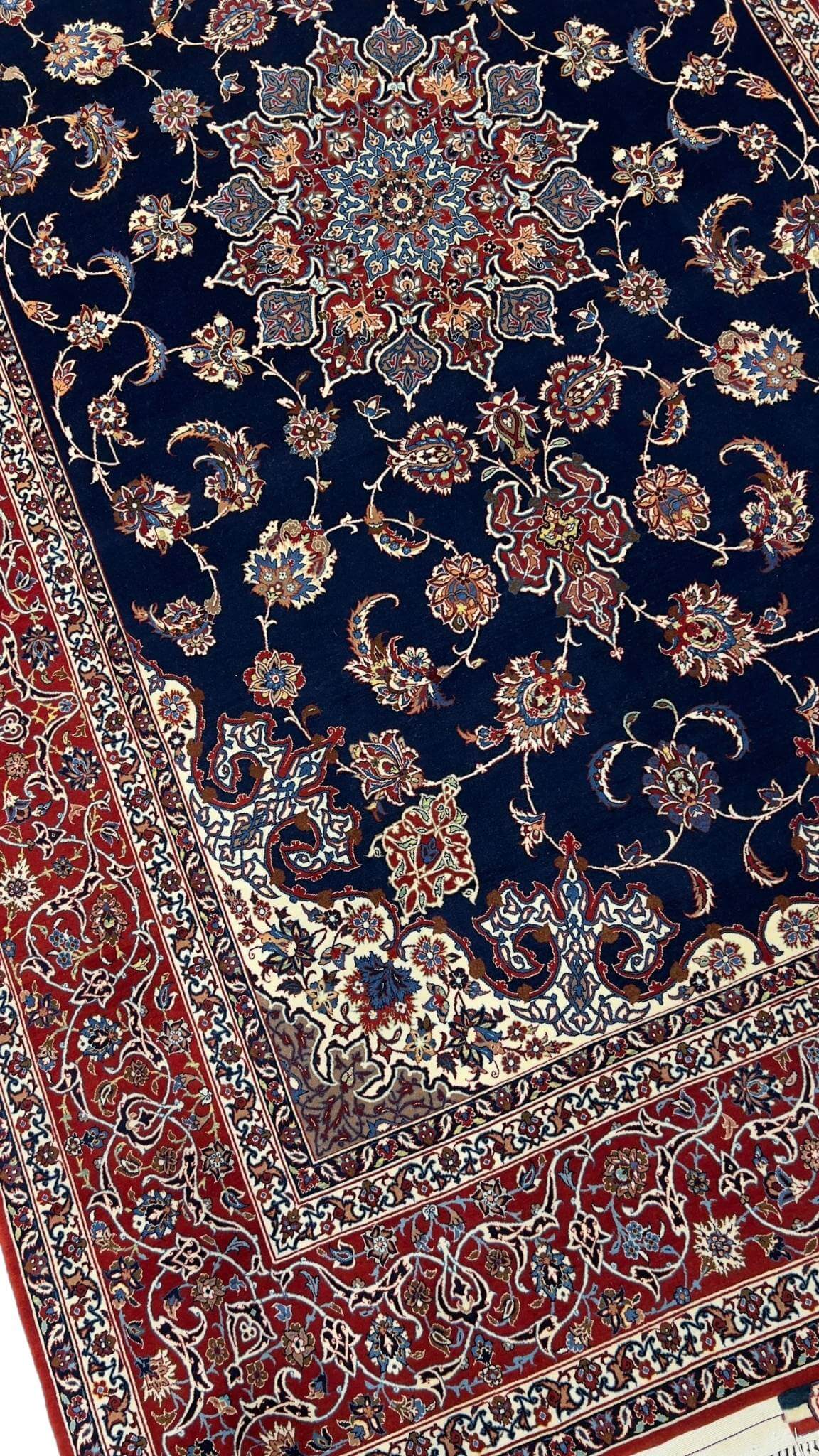 "Close-up of Seirafian Persian rug detailing luxurious handwoven craftsmanship."
