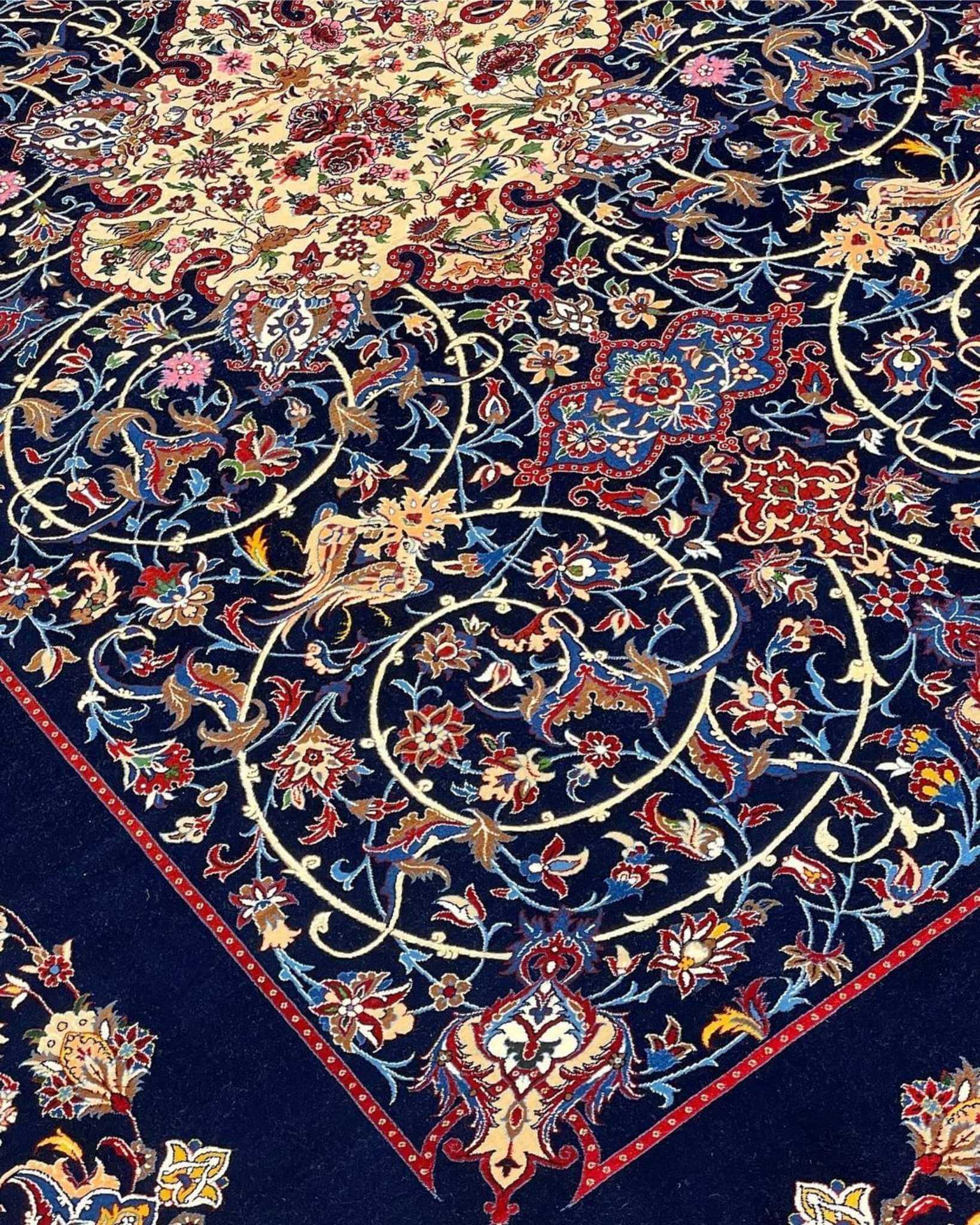 "Isfahan rug with navy blue base and vibrant floral medallion by Bagher Seirafian."
