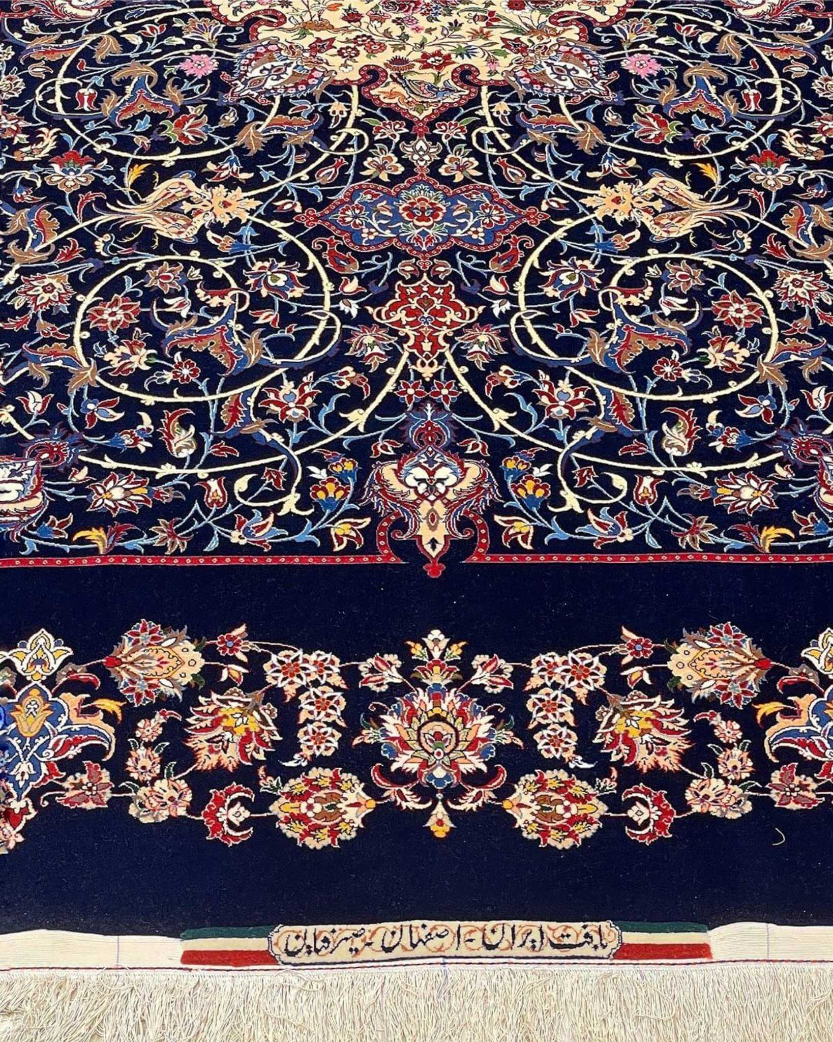 "Timeless navy blue Persian rug, handmade in Isfahan with natural dyes."
