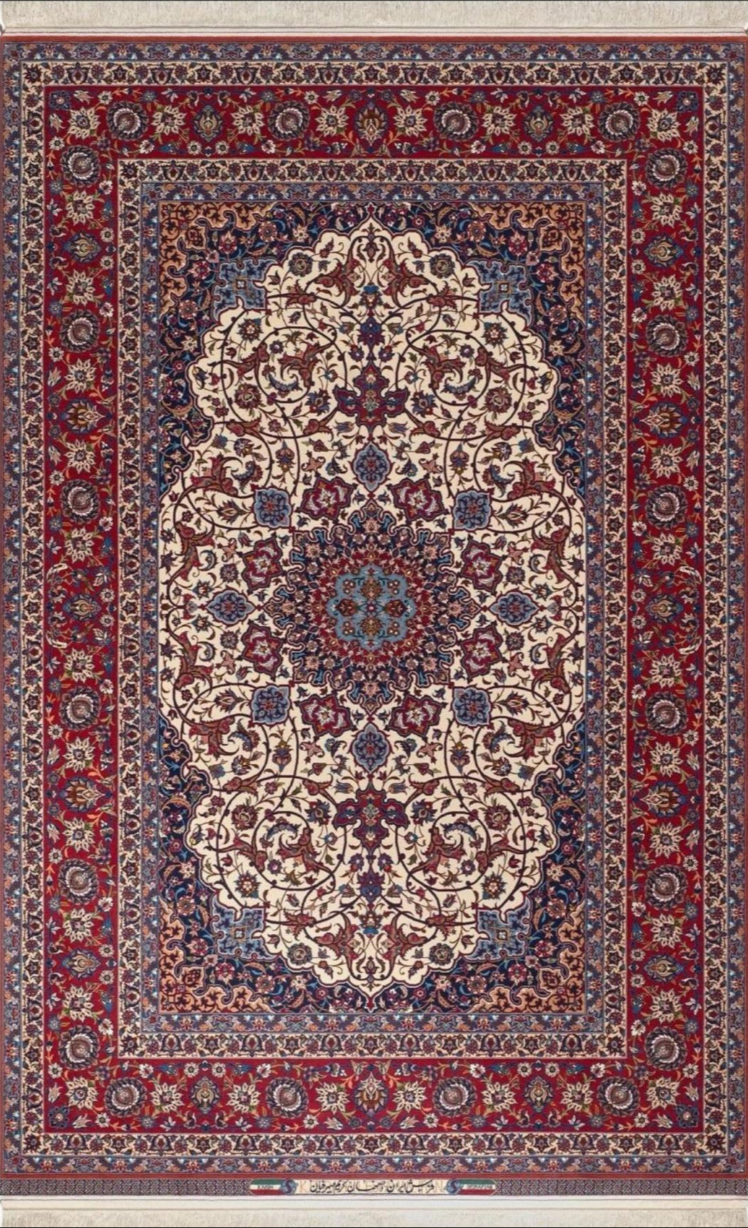 Exquisite Isfahan rug hand-knotted by Grand Master Karim Seirafian, showcasing intricate floral designs in red, blue, and ivory tones.
