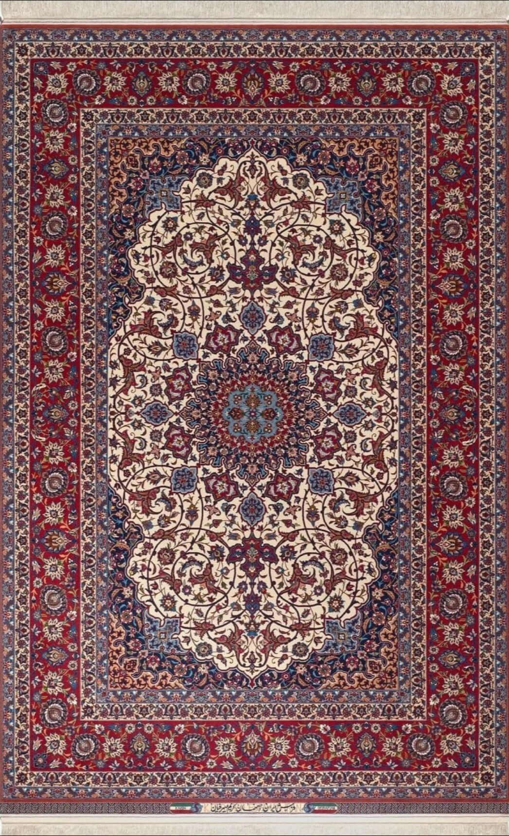 Exquisite Isfahan rug hand-knotted by Grand Master Karim Seirafian, showcasing intricate floral designs in red, blue, and ivory tones.
