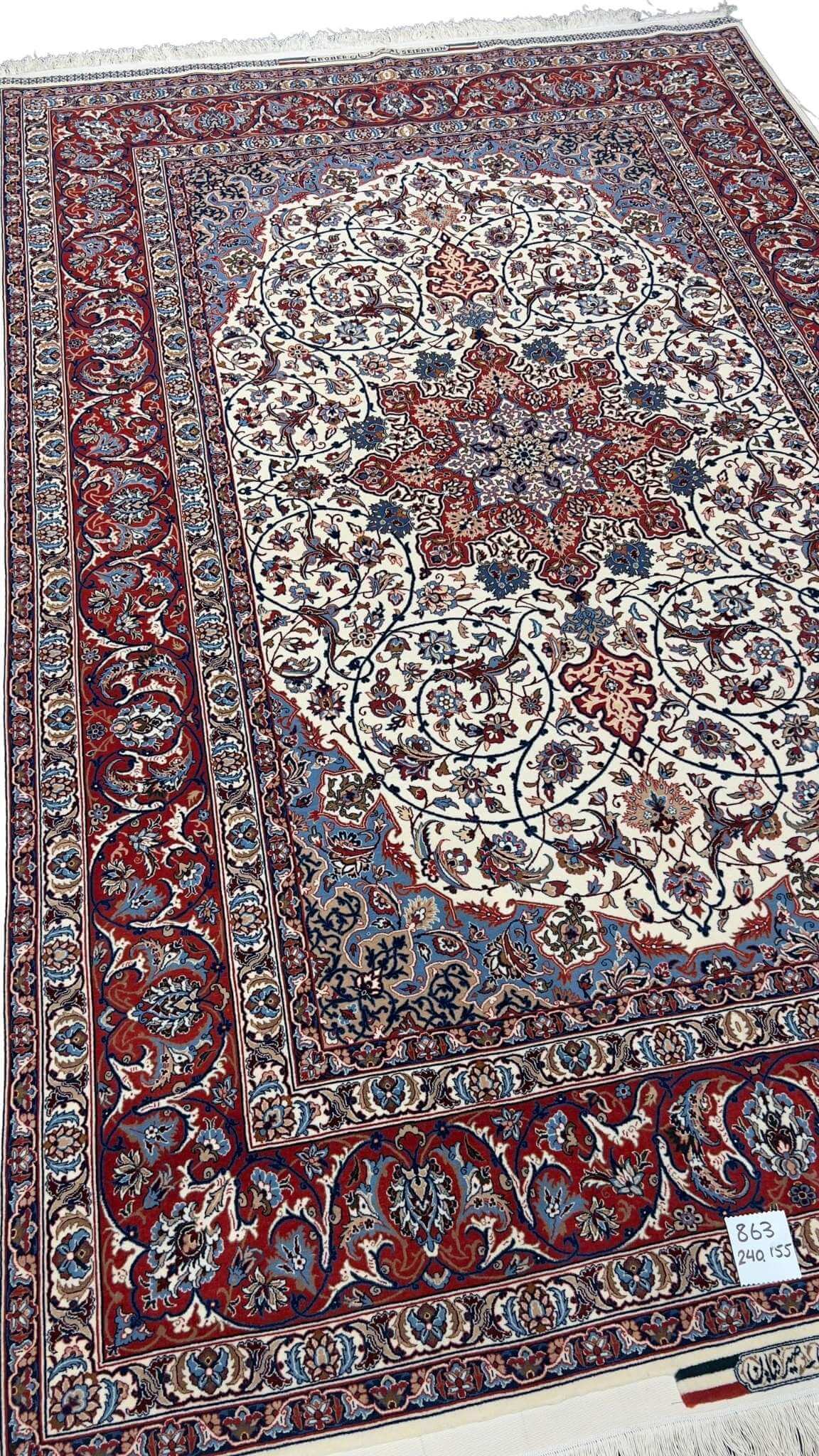 "Close-up of intricate floral motifs on a wool and silk Persian rug with a high knot density of 1,440,000 knots/m²."
