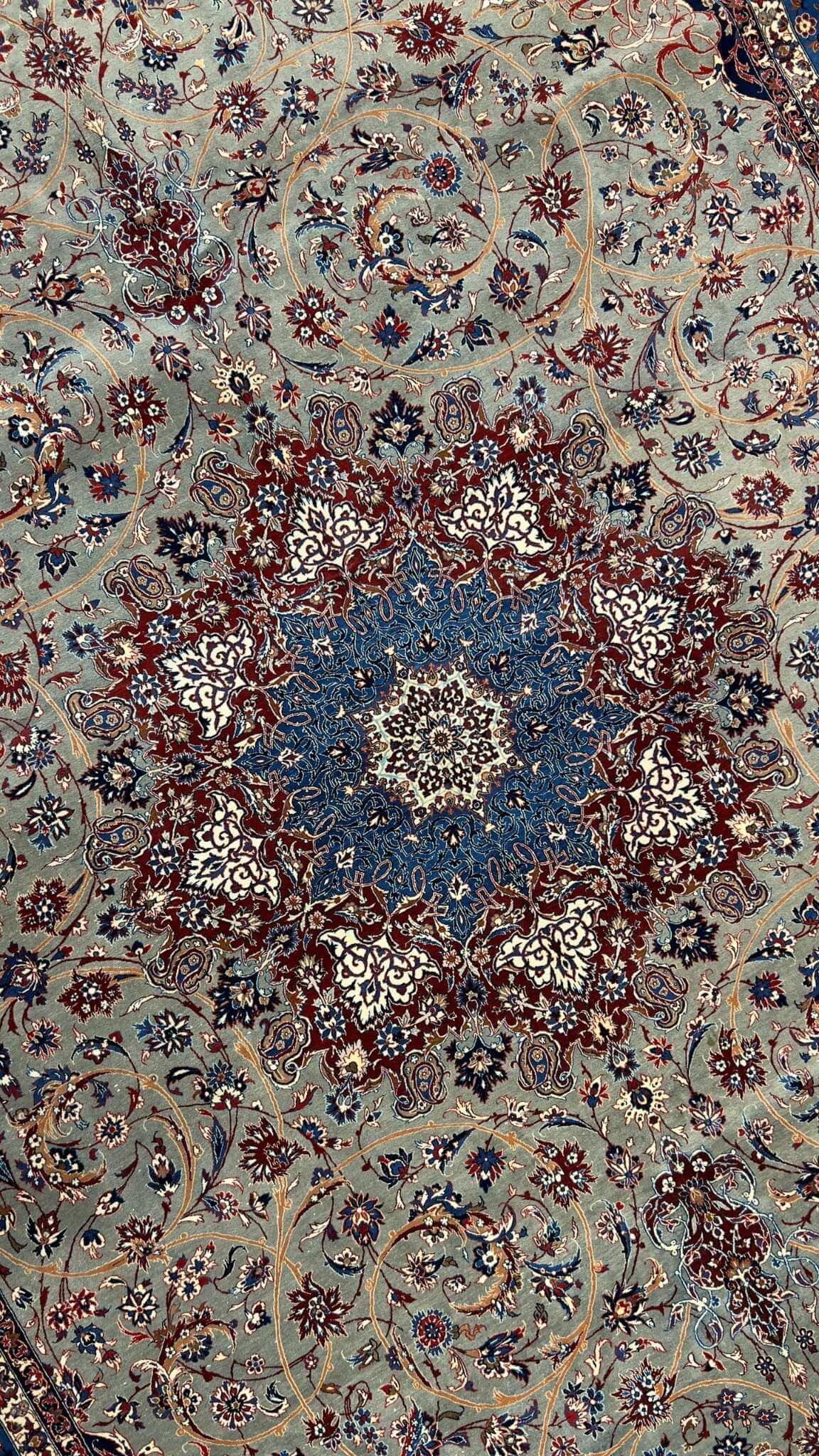 "Close-up of intricate Persian rug weaving by Seirafian masters"