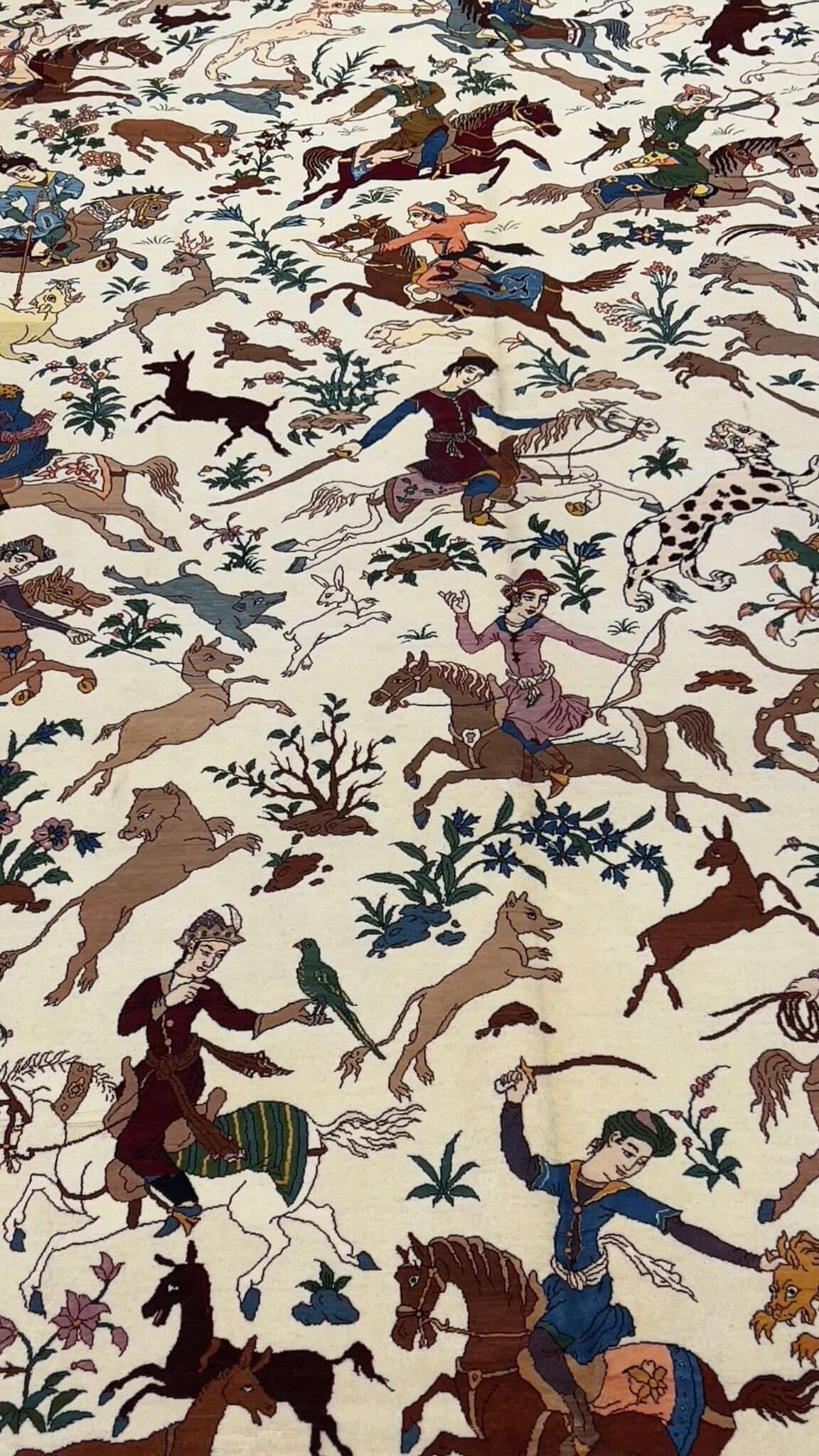 "Traditional hunting scene area rug, handmade by Master Hassan Seirafian."

