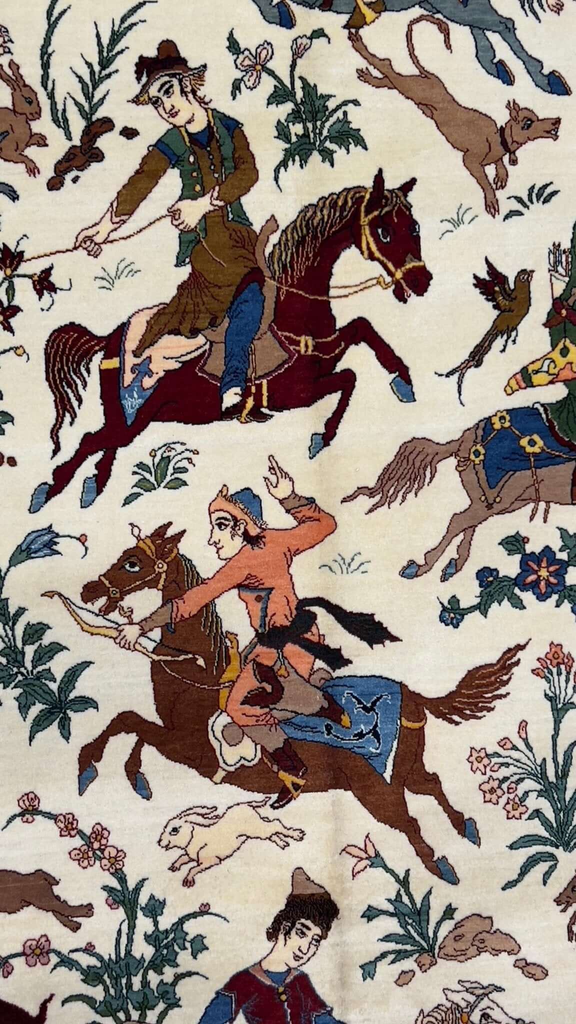 "Elegant Seirafian rug with intricate horse riders and wildlife depictions."
