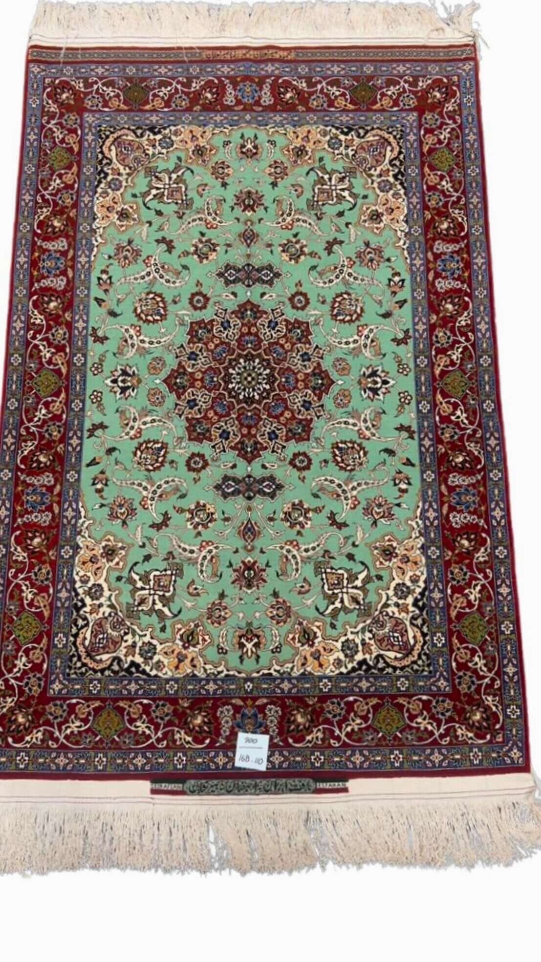 Hand-knotted Seirafian Persian rug with mint green and crimson red accents.
