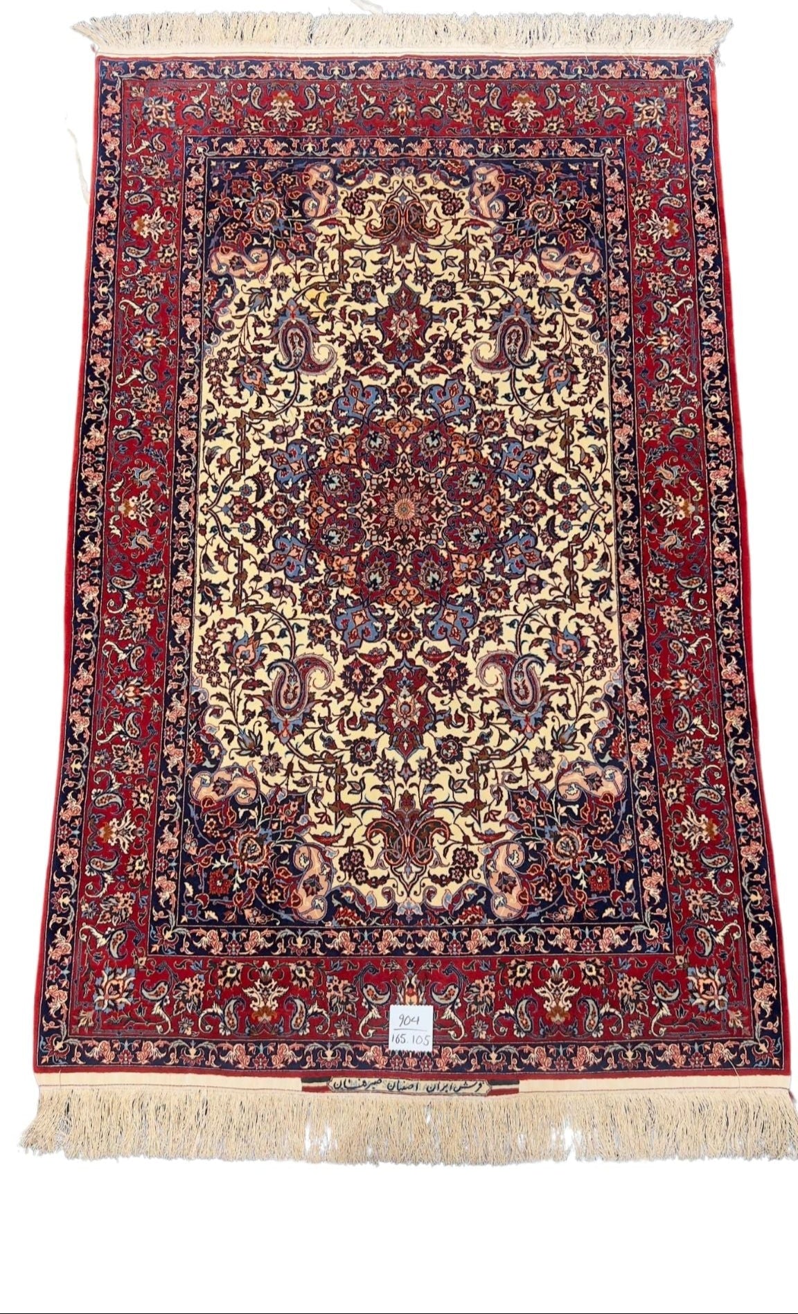 Decorative Seirafian rug, handwoven with natural dyes and silk accents.
