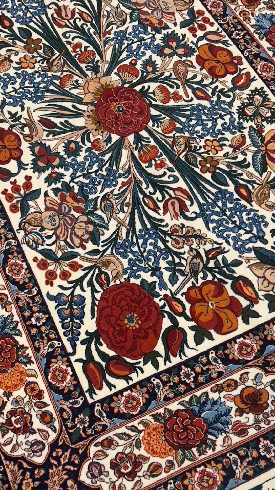 Detailed Seirafian rug featuring elegant floral patterns and hand-knotted precision.
