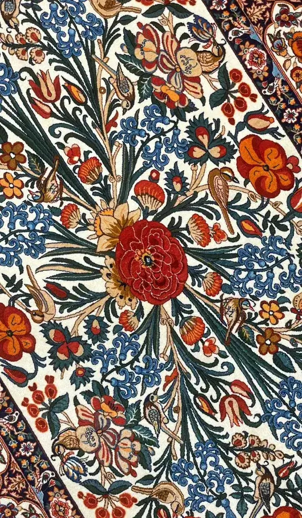 Authentic Isfahan rug with roses, butterflies, and ornamental borders by Mehdie Seirafian.
