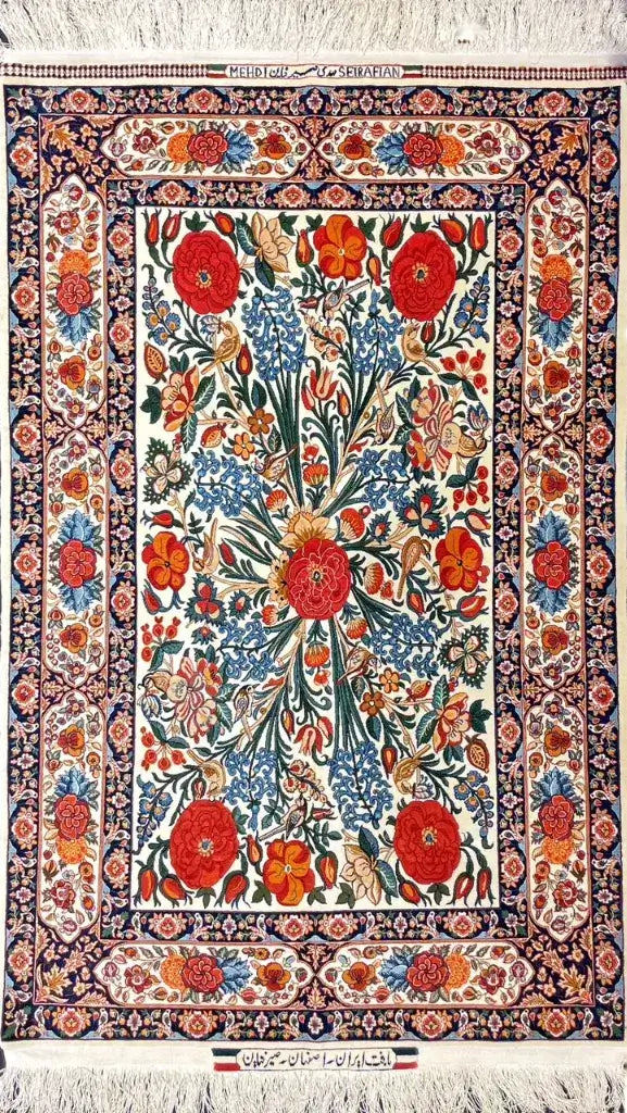 Elegant Seirafian floral rug with a silk warp and exquisite hand-knotted artistry.
