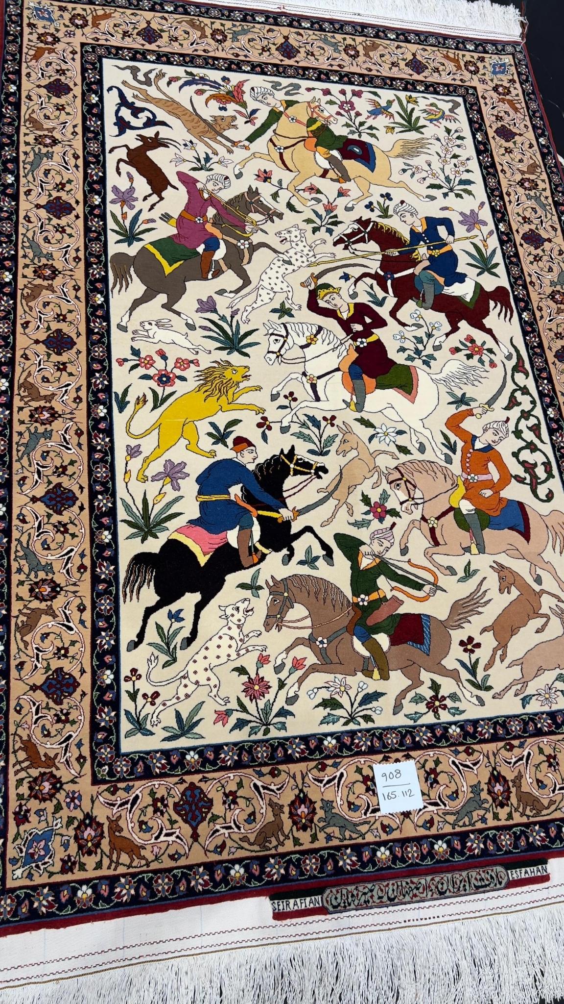 Seirafian rug from Isfahan with a silk foundation and lifelike hunting designs.
