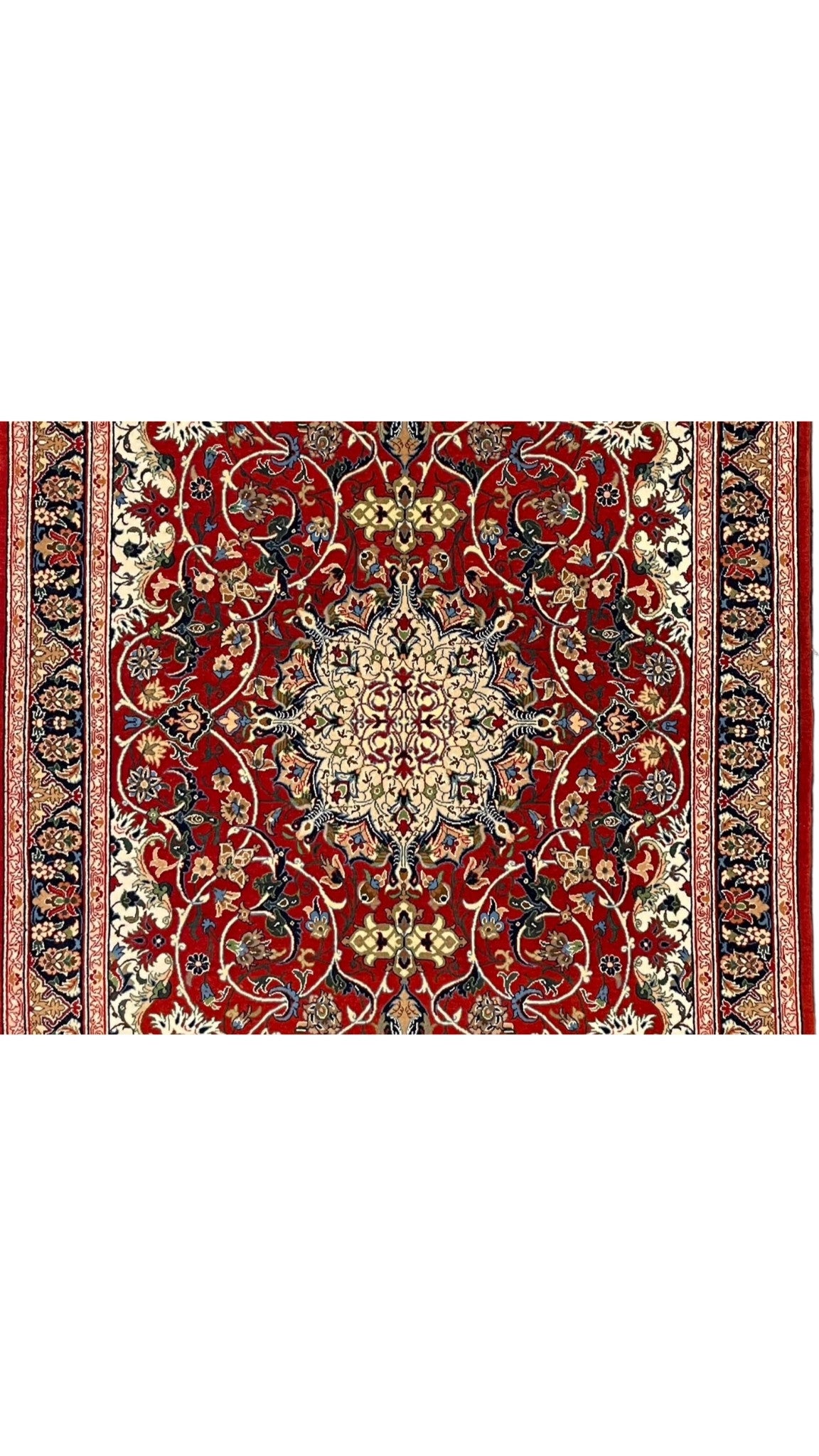 Luxurious wool and silk Persian carpet with vibrant natural dye patterns.
