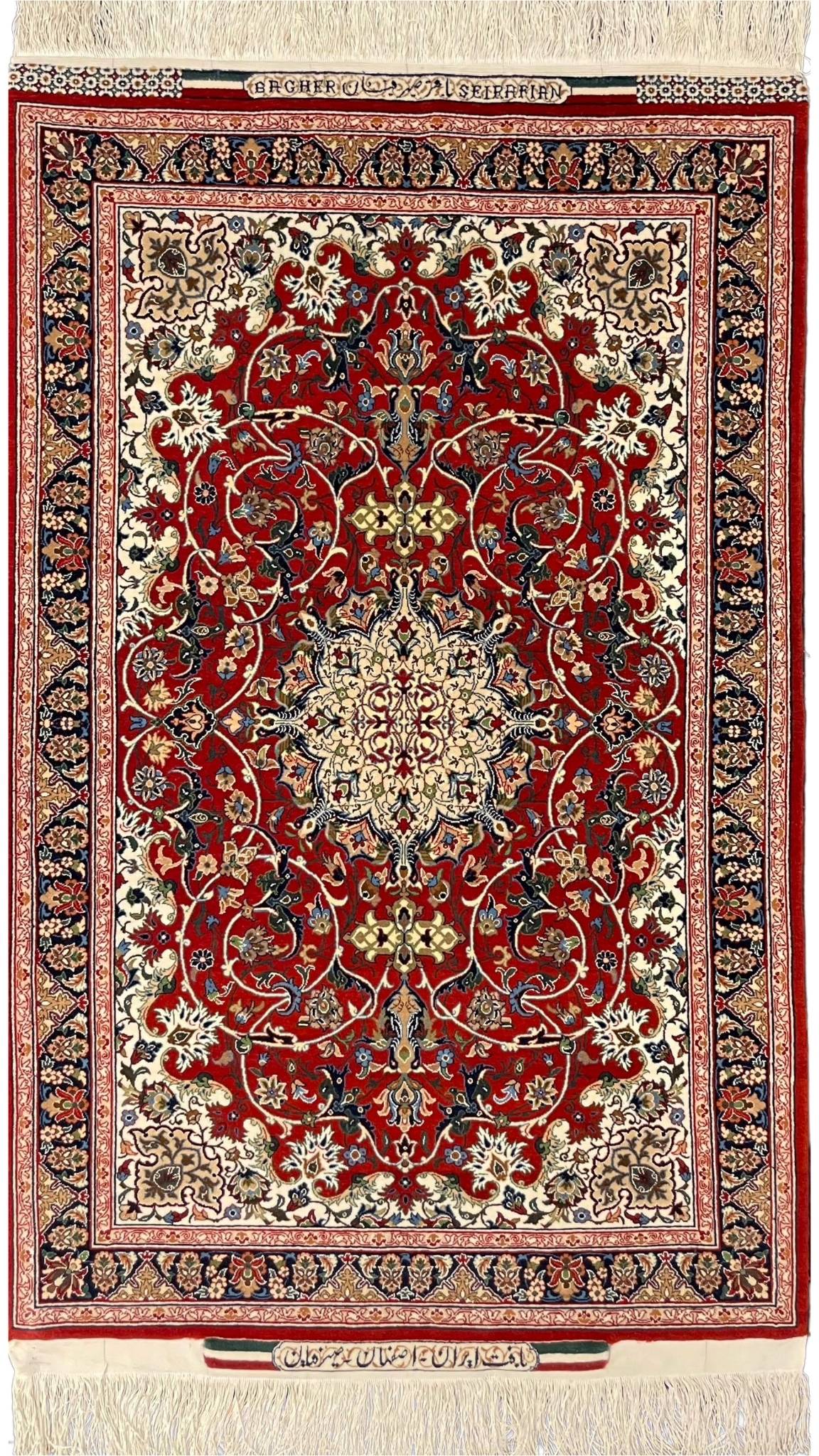 Elegant Seirafian Isfahan rug in red, cream, and navy with intricate medallion design.
