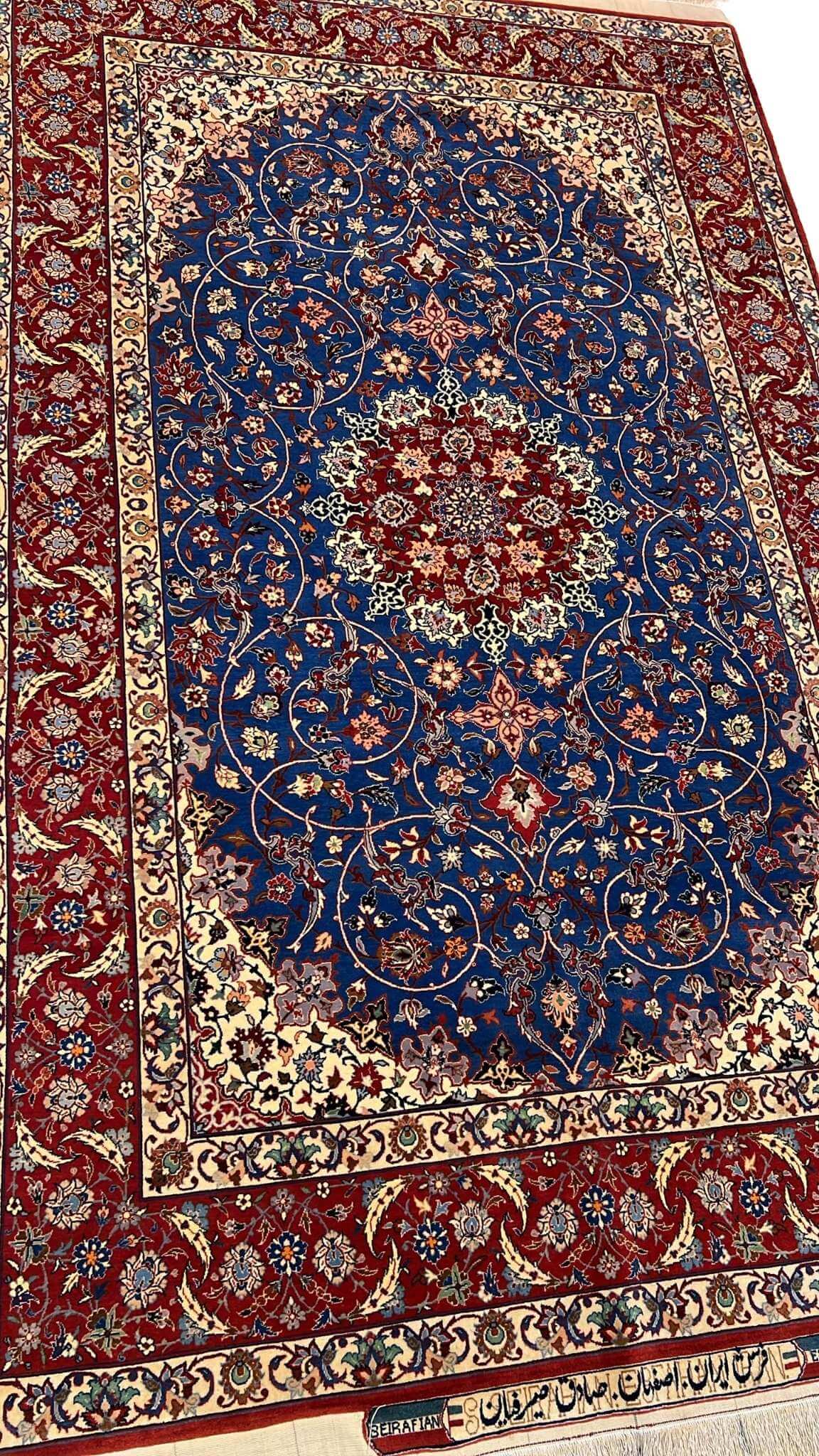 "Hand-knotted wool and silk Persian rug from Sadegh Seirafian, showcasing intricate floral patterns."

