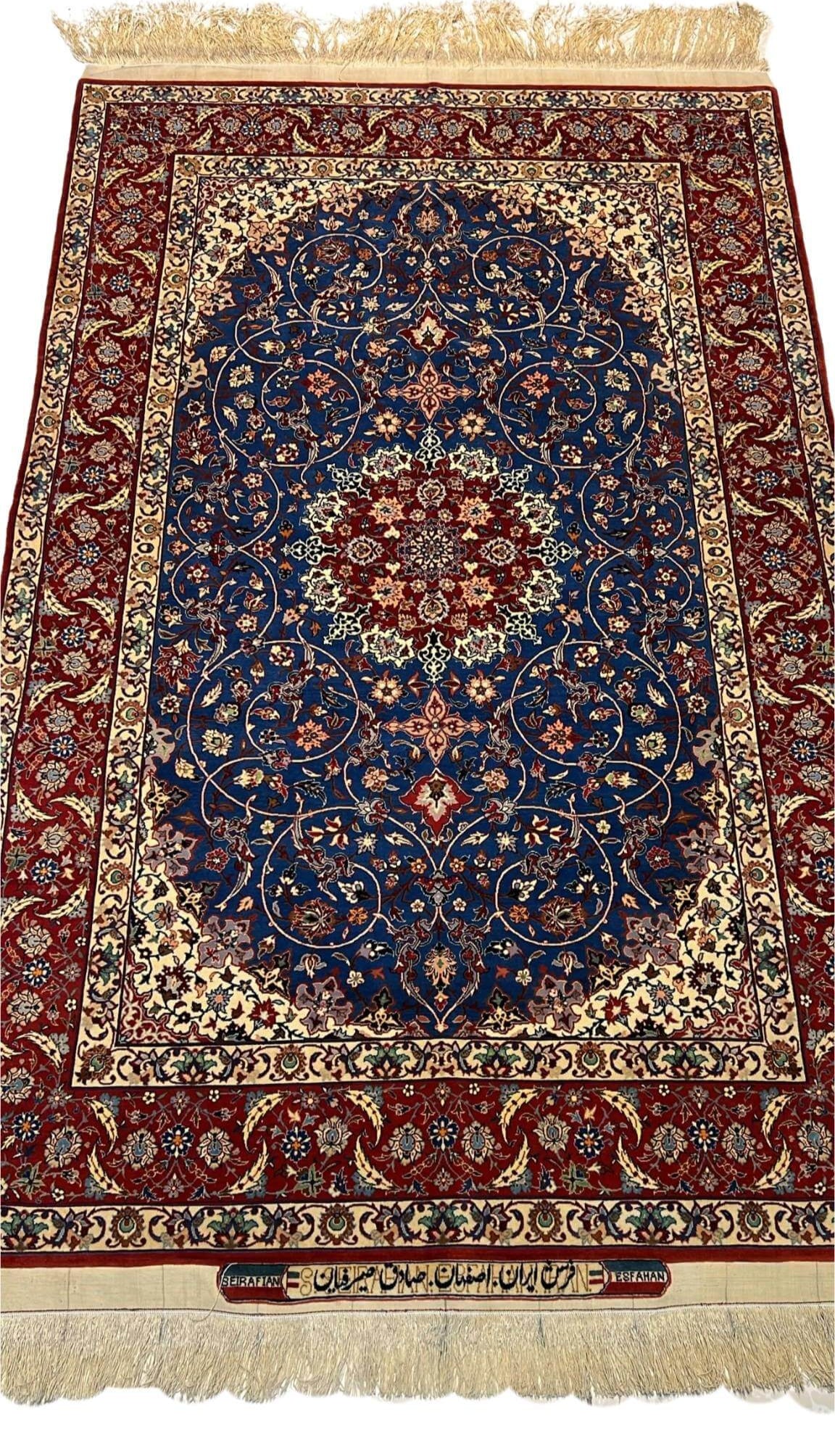 "Vintage hand-knotted Persian rug by Sadegh Seirafian, featuring intricate designs in wool and silk."

