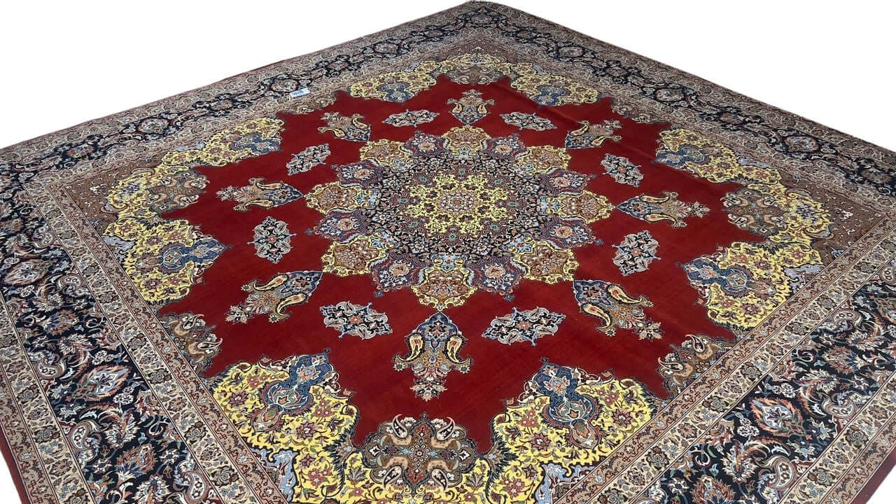 "Large Isfahan rug with striking red and gold color palette, perfect for elegant interiors."
