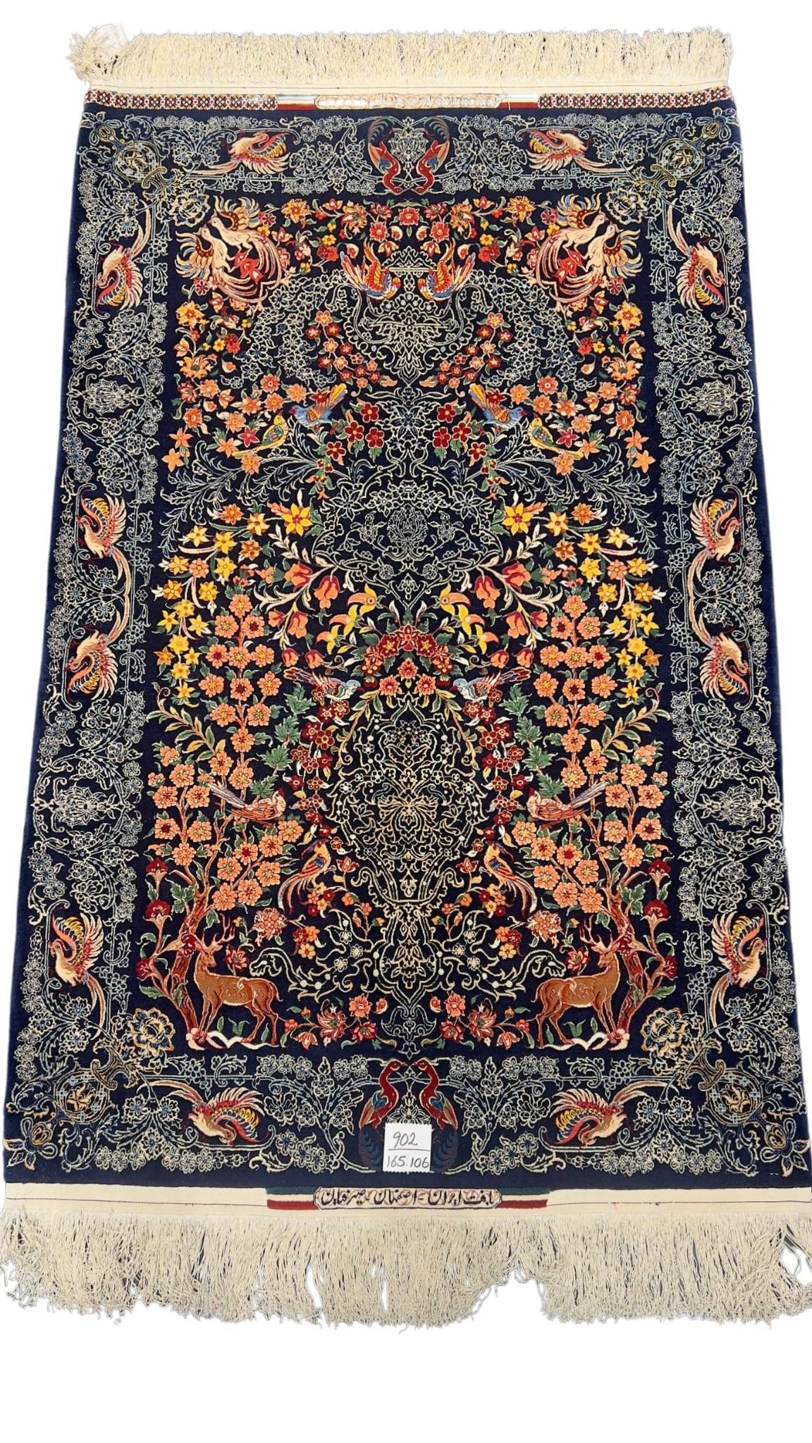 Hand-knotted Seirafian rug featuring deer, florals, and birds in a vibrant design.
