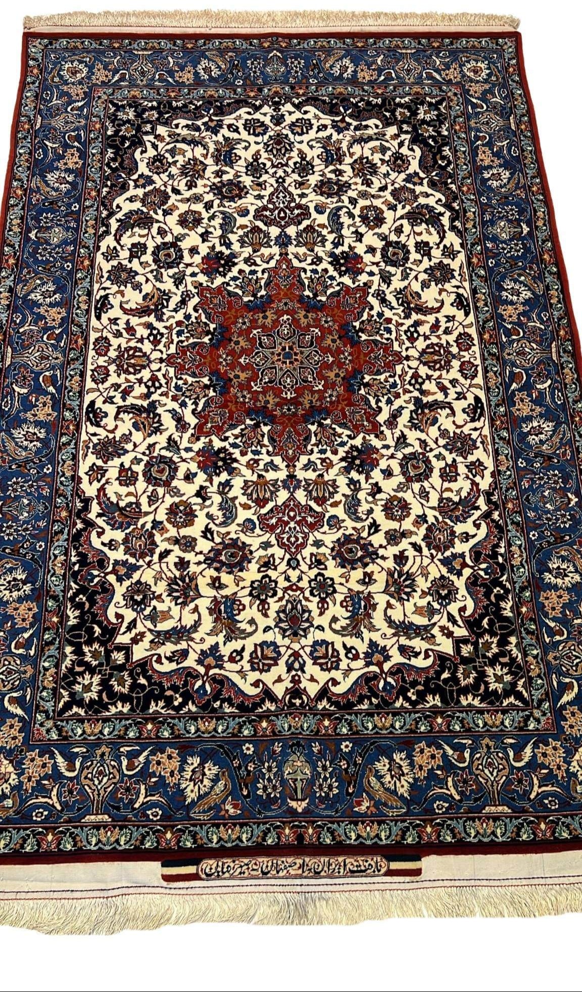 "Intricately handwoven Seirafian Persian rug with wool and silk blend, featuring a stunning medallion design."

