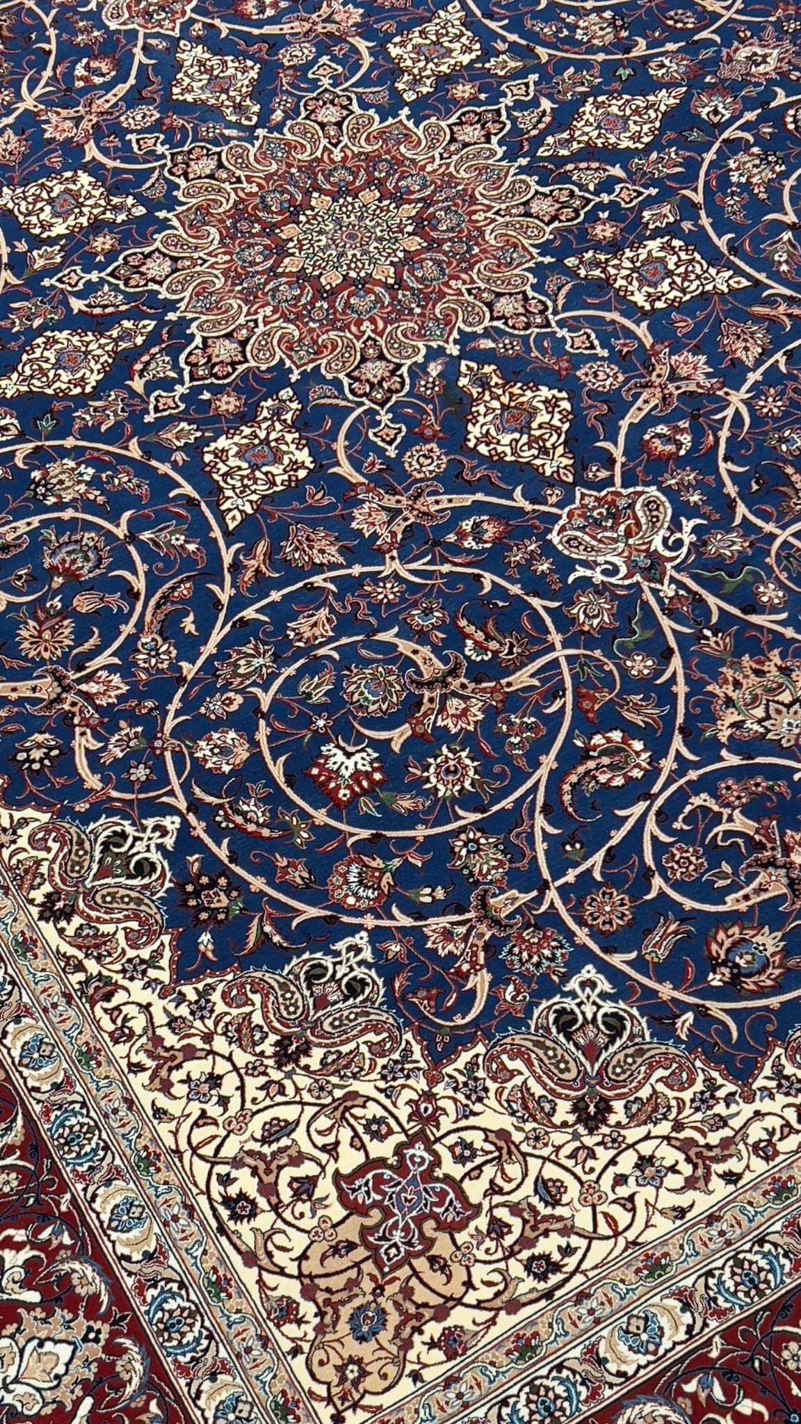 "Large Isfahan rug showcasing a sophisticated combination of traditional Persian patterns and colors."
