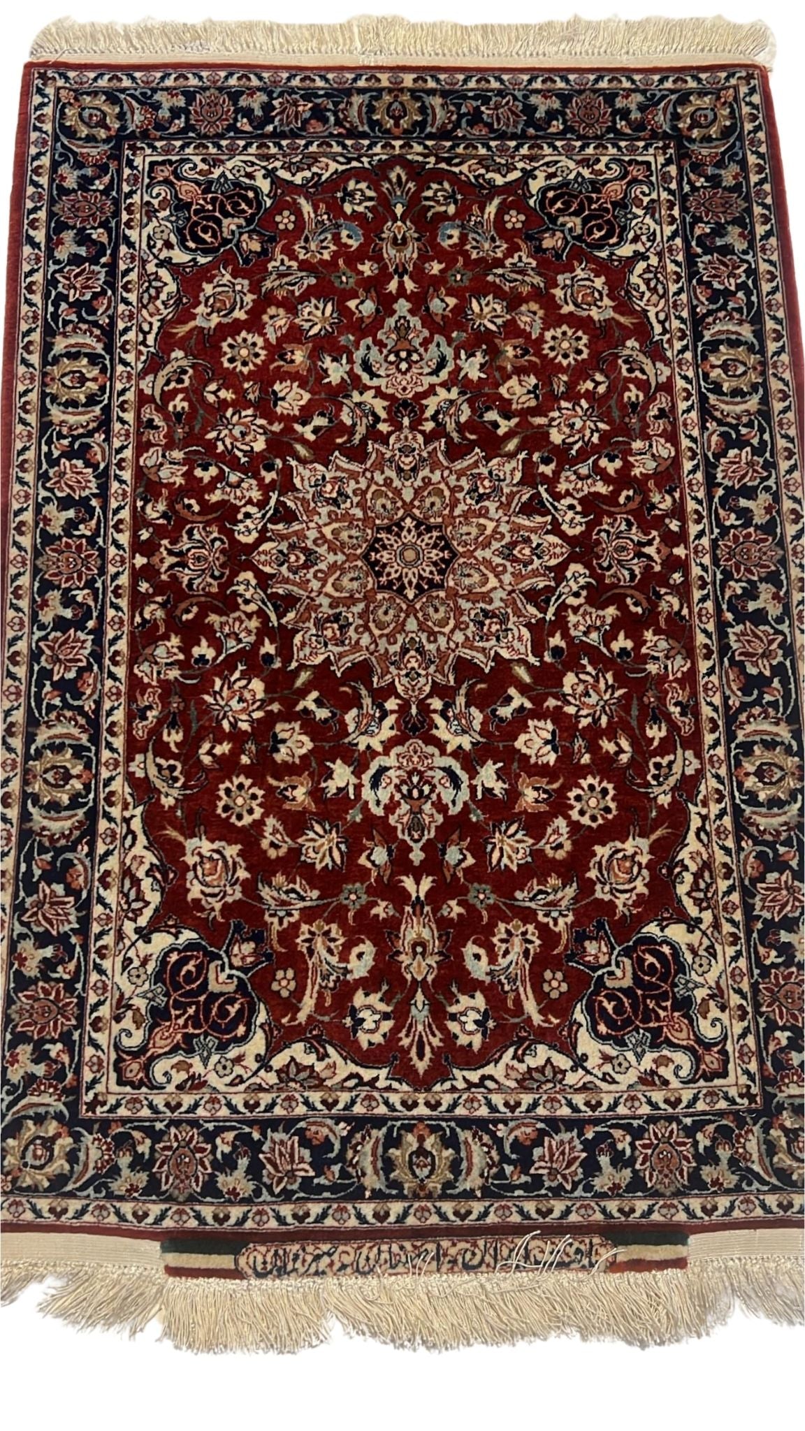 Semi-antique small Seirafian black and red Persian rug showcasing intricate floral designs and bold colors.