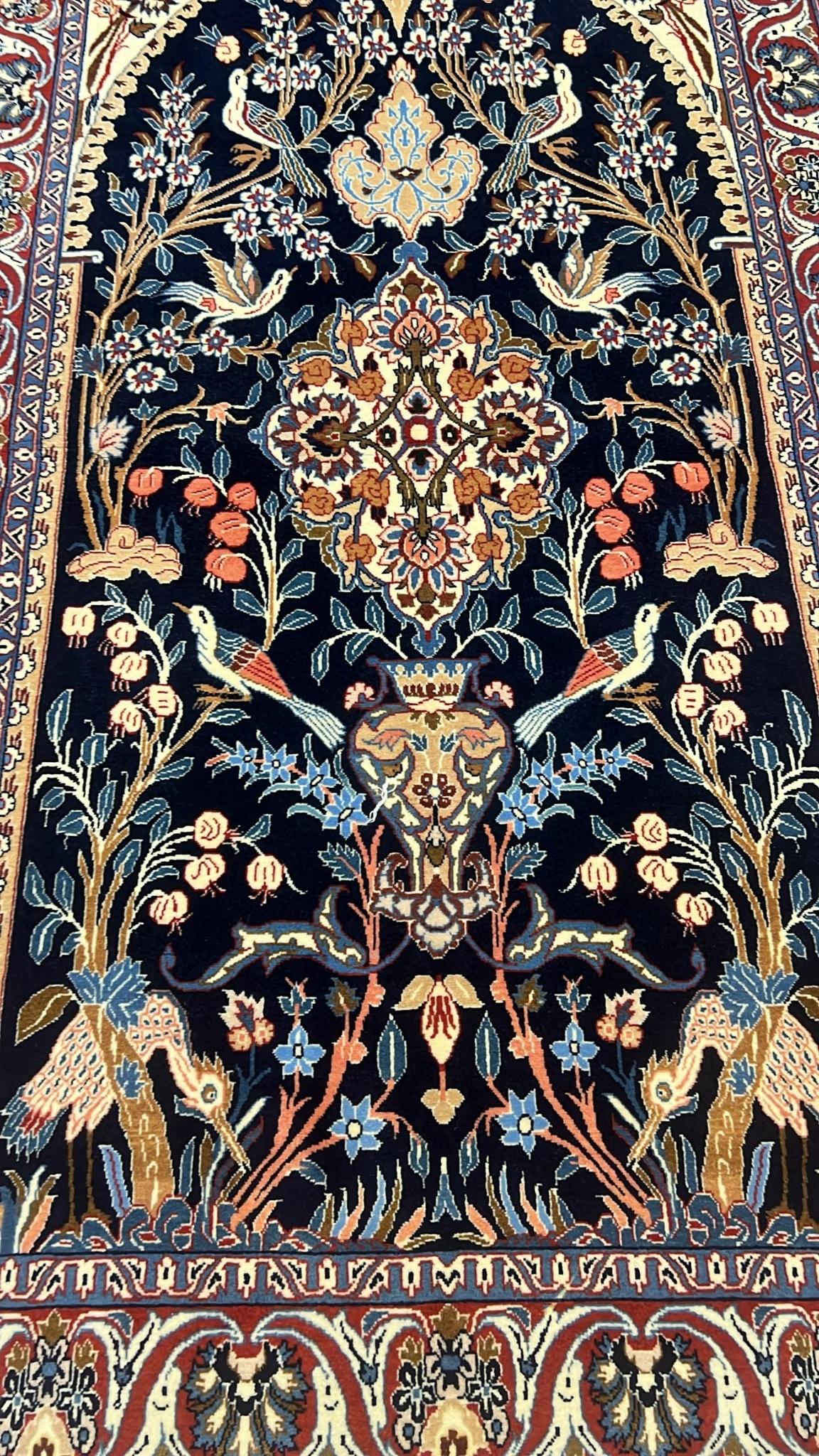 lose-up of the Intricate Knotwork and Floral Design on a Seirafian Rug