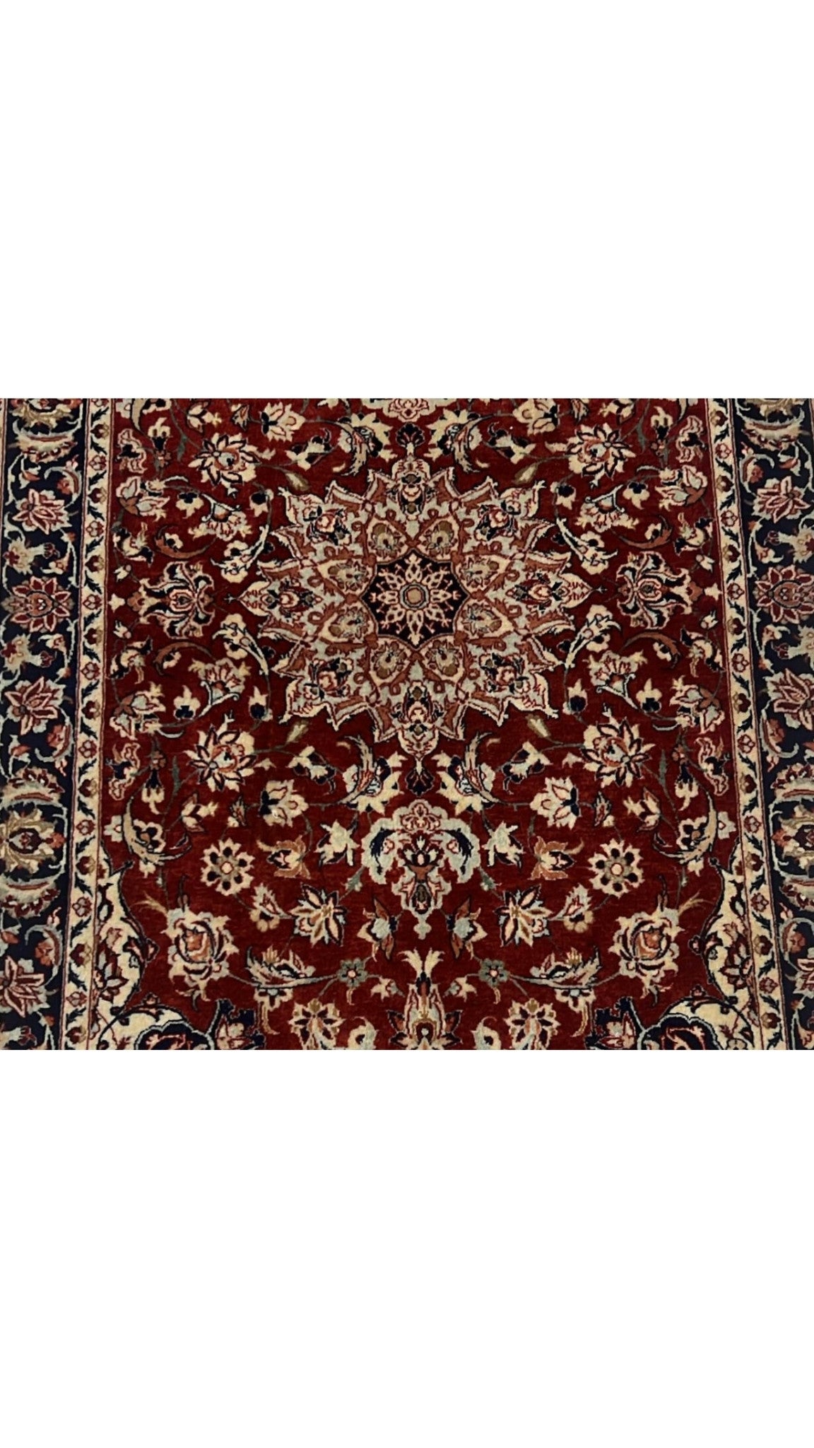 Hand-knotted Seirafian Persian rug in black and red, featuring traditional Isfahan craftsmanship.
