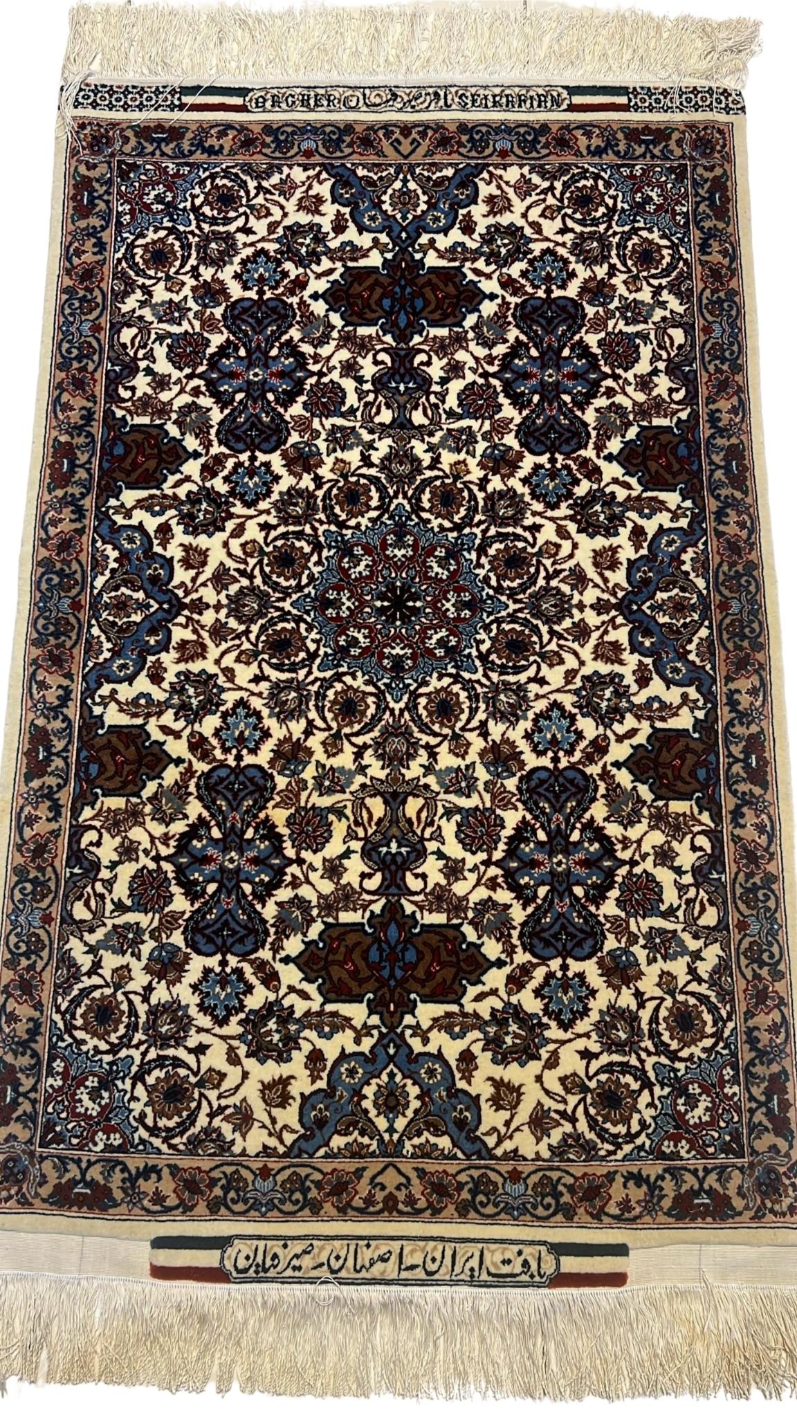 Authentic small 3x2 beige Seirafian Persian carpet, hand-knotted with silk and wool, showcasing intricate floral designs.