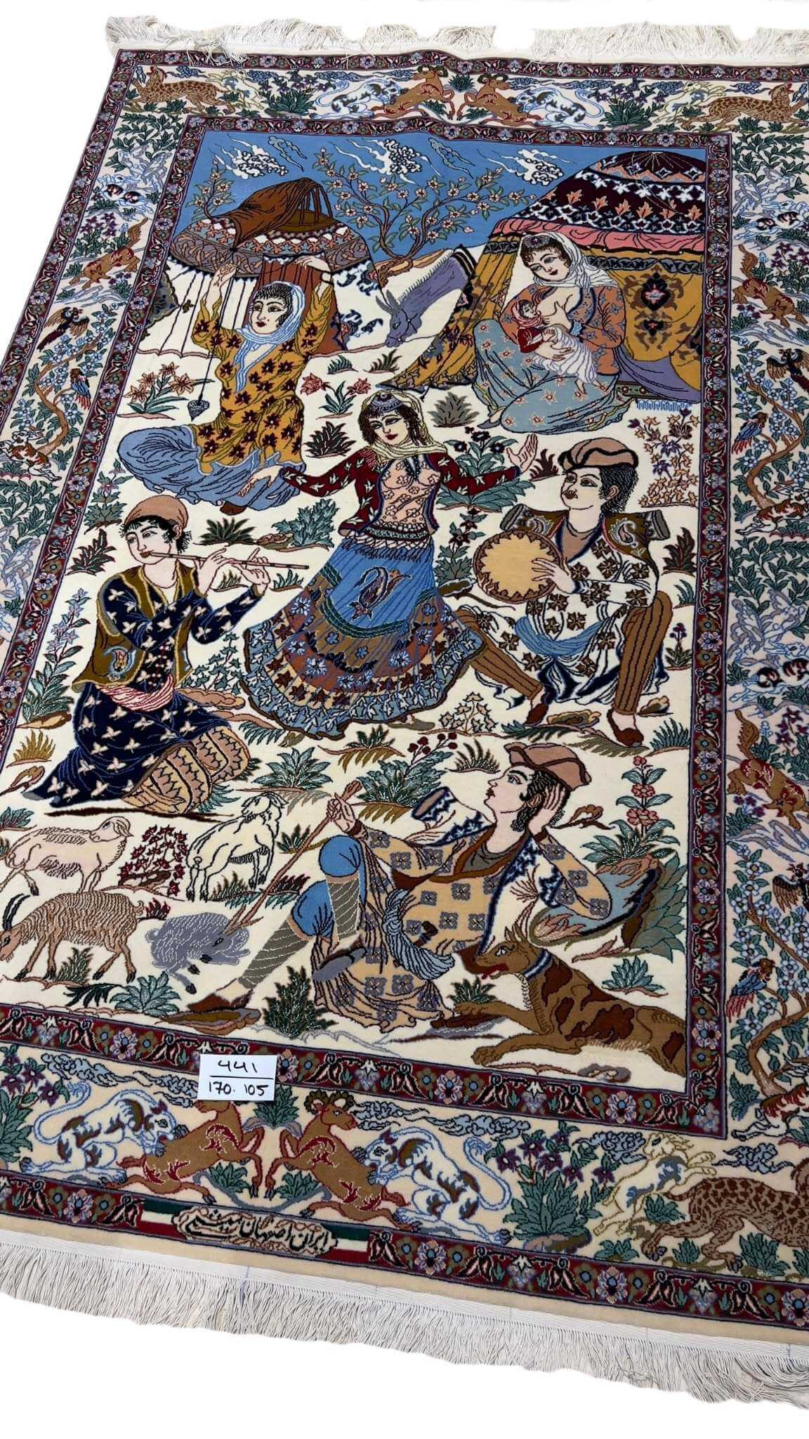 "Luxurious Persian rug handcrafted in Isfahan, 175 cm x 105 cm, made from fine wool and silk, offering intricate designs and high knot density for an elegant touch to your space."
