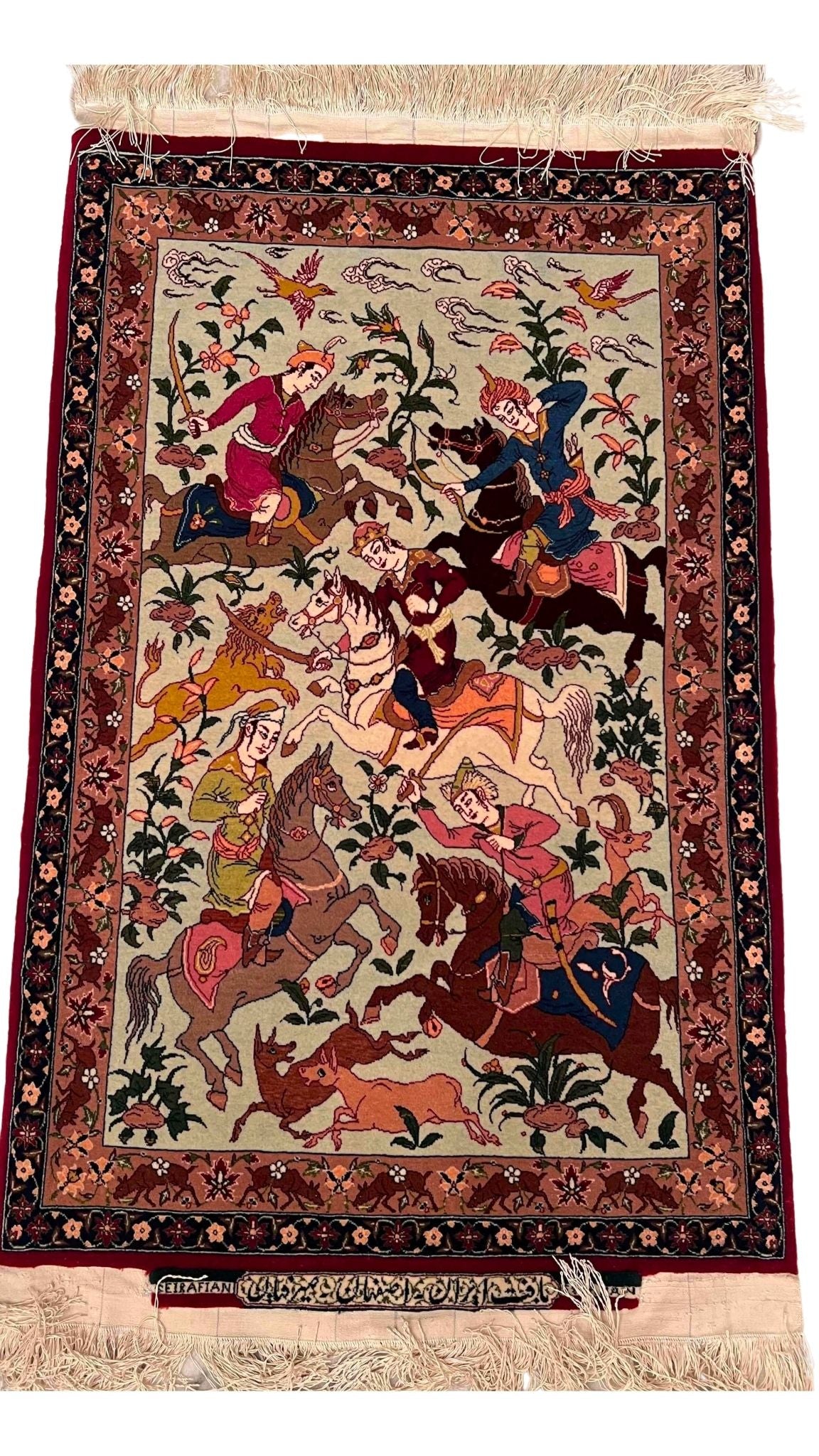 Close-up of detailed hunting scene on Green Seirafian Persian Rug.