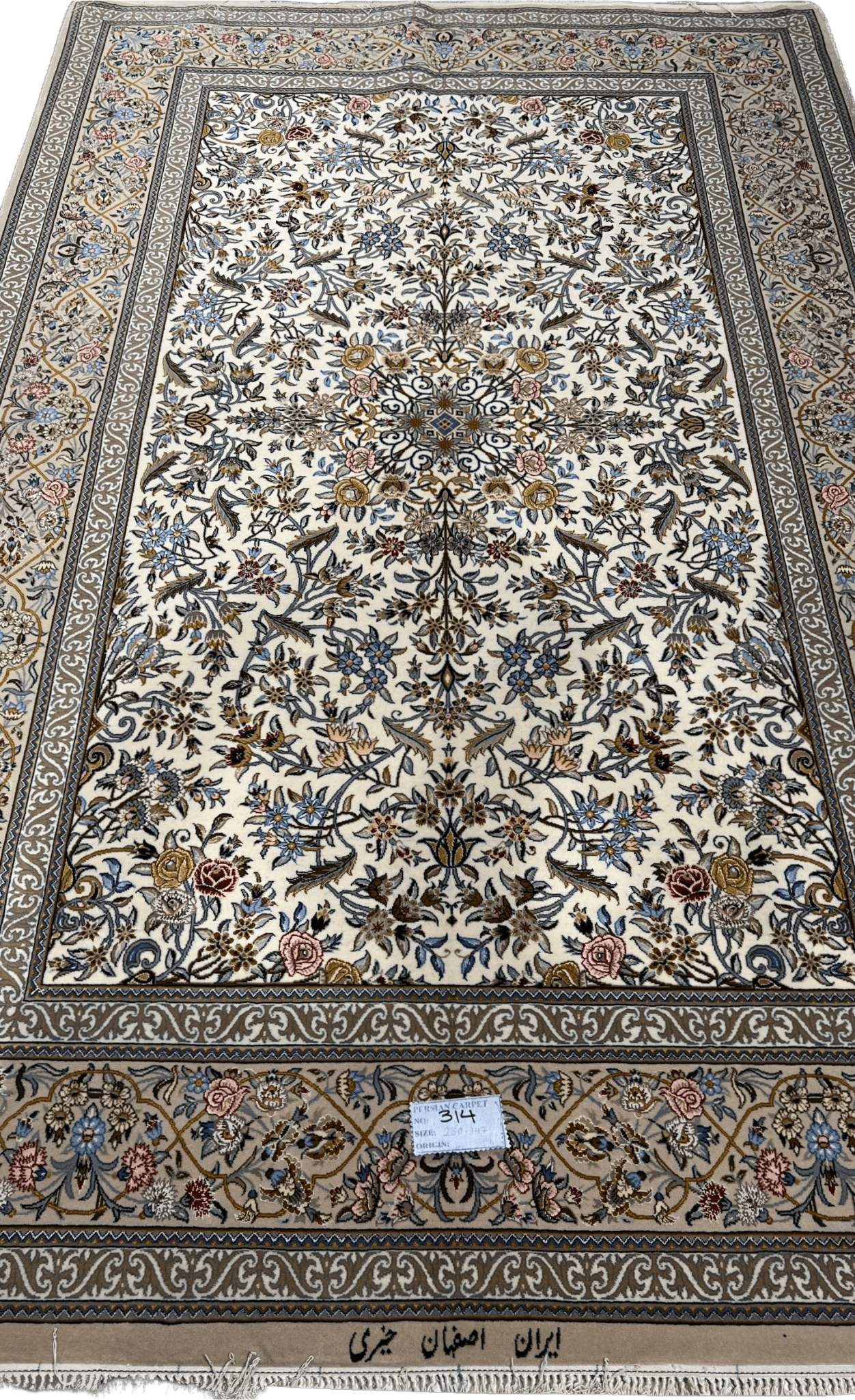 "Exquisite handwoven Isfahan Persian rug featuring intricate floral motifs, silk-wool blend, and a delicate ivory background."