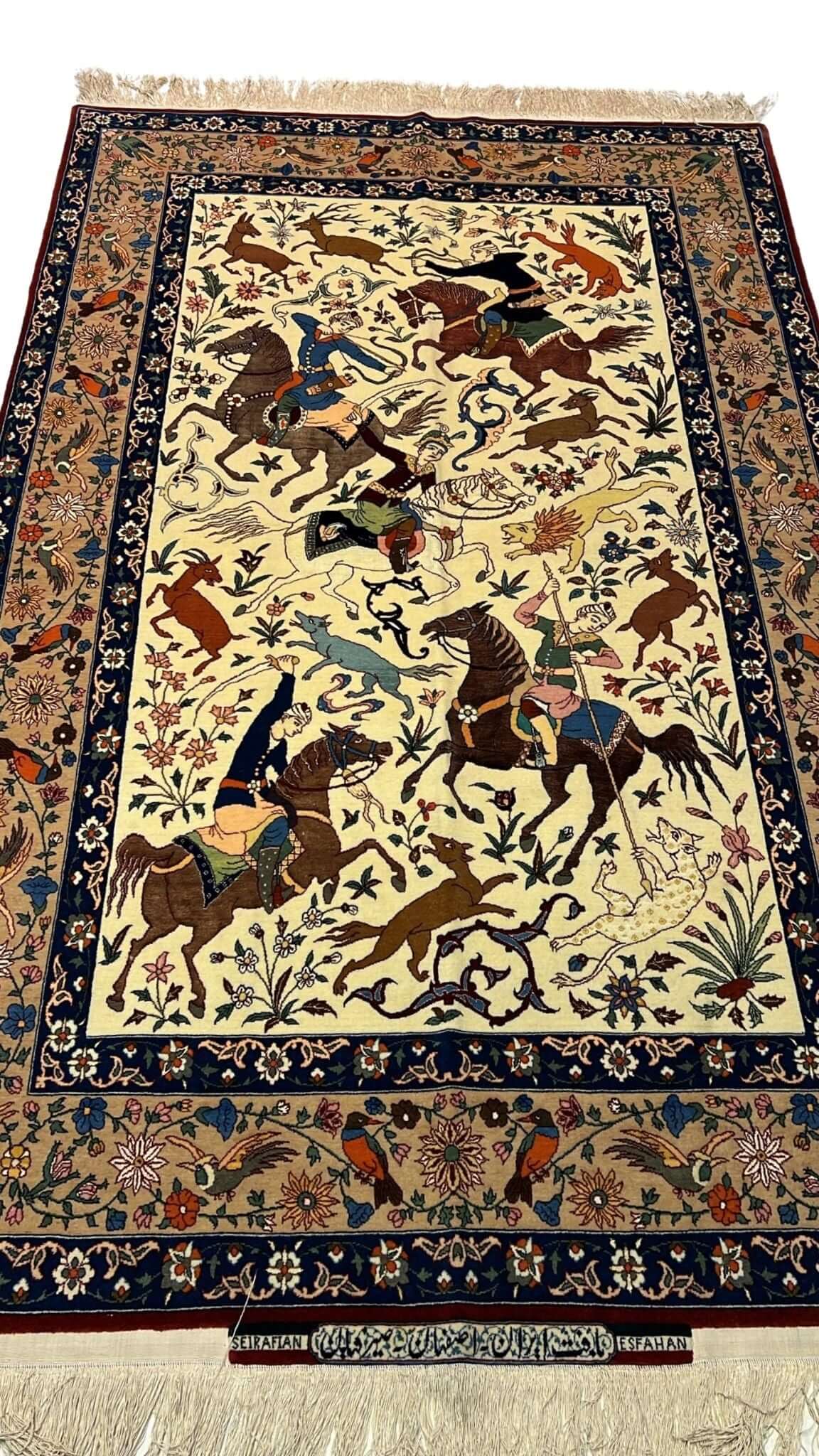 Full view of a hand-knotted Seirafian hunting scene rug, crafted by Master Ahmad Seirafian with silk and wool.
