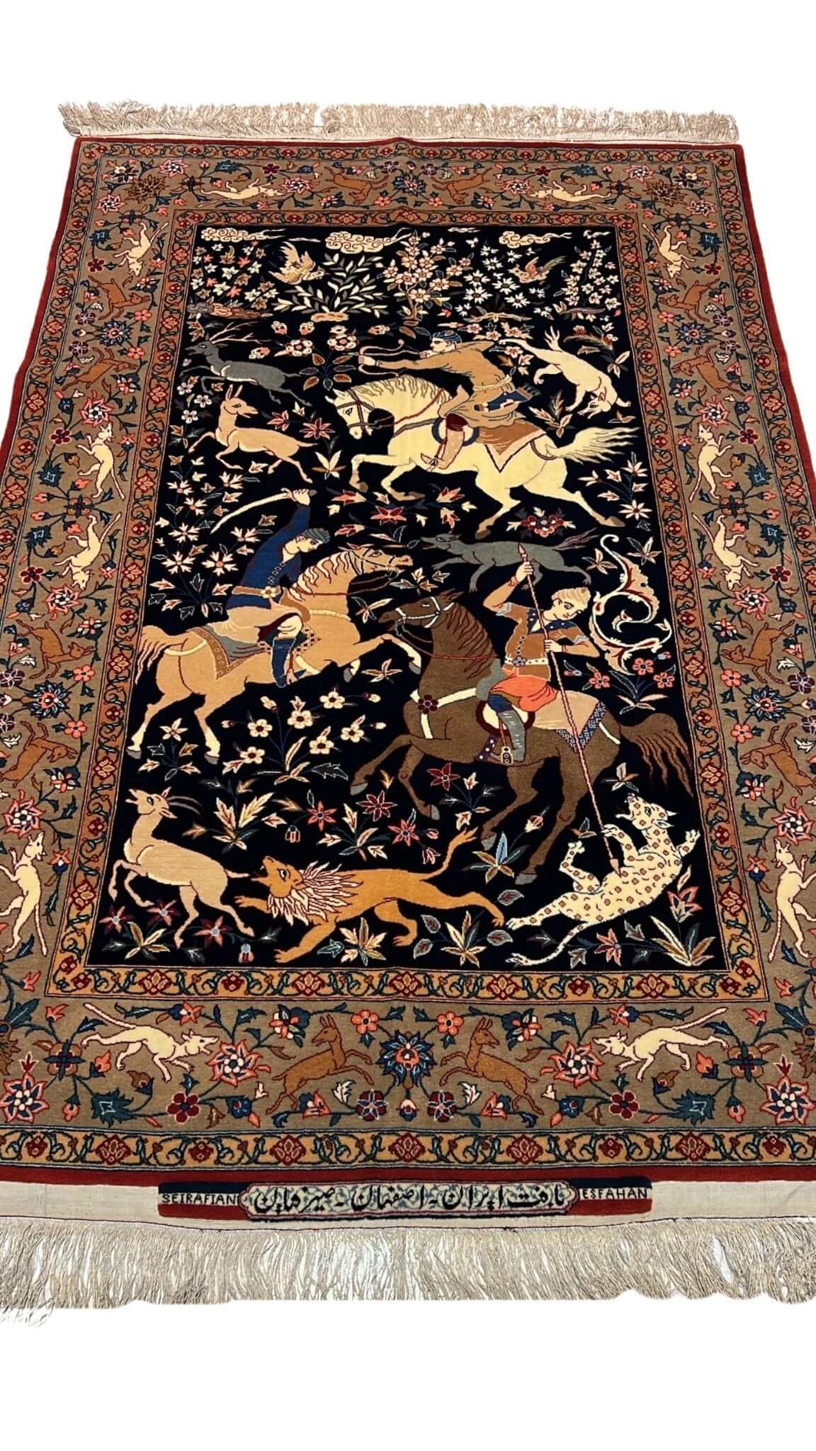 Close-up view of the Seirafian Hunting Scene rug, showcasing intricate hand-knotted silk and wool craftsmanship.
