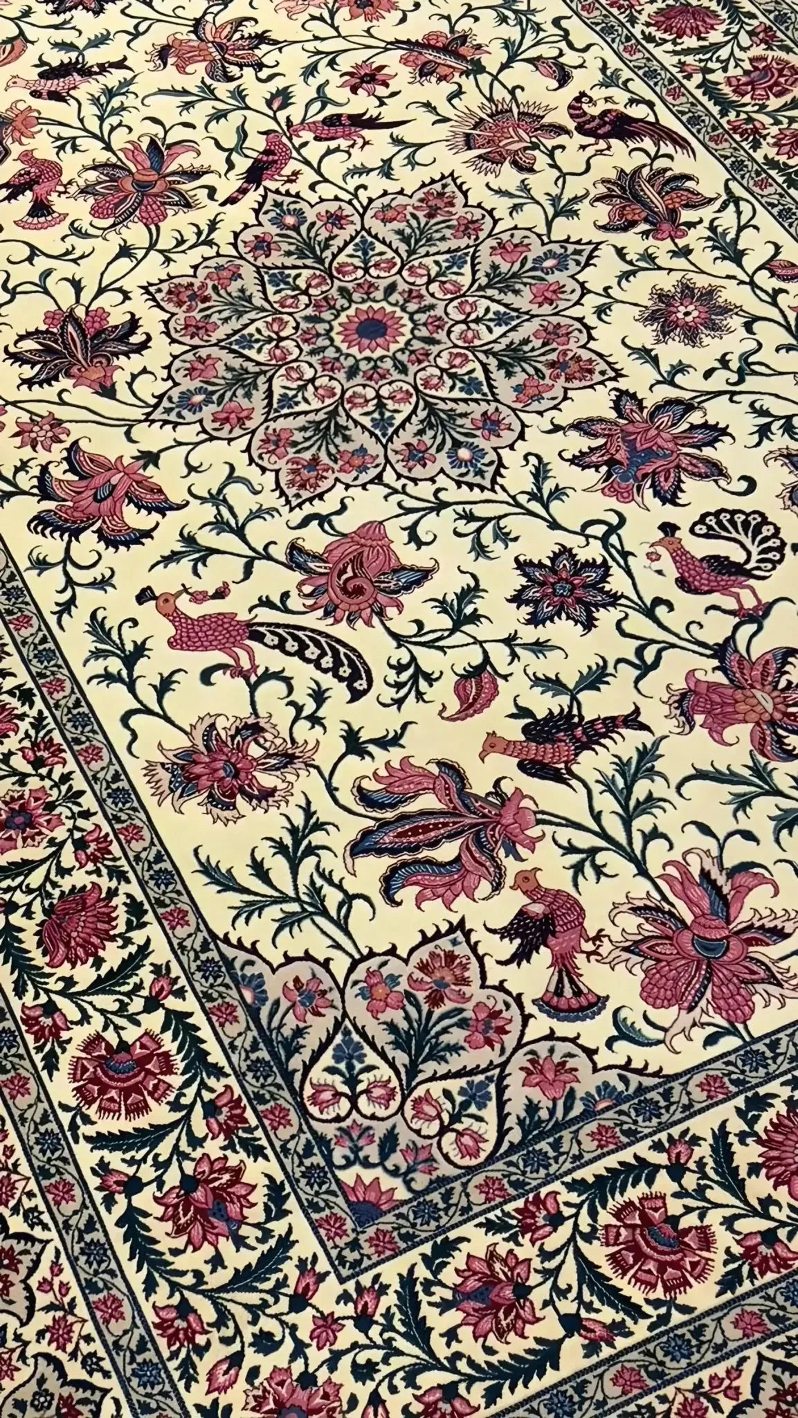 Full view of a large Sadegh Seirafian oriental rug with elaborate floral motifs