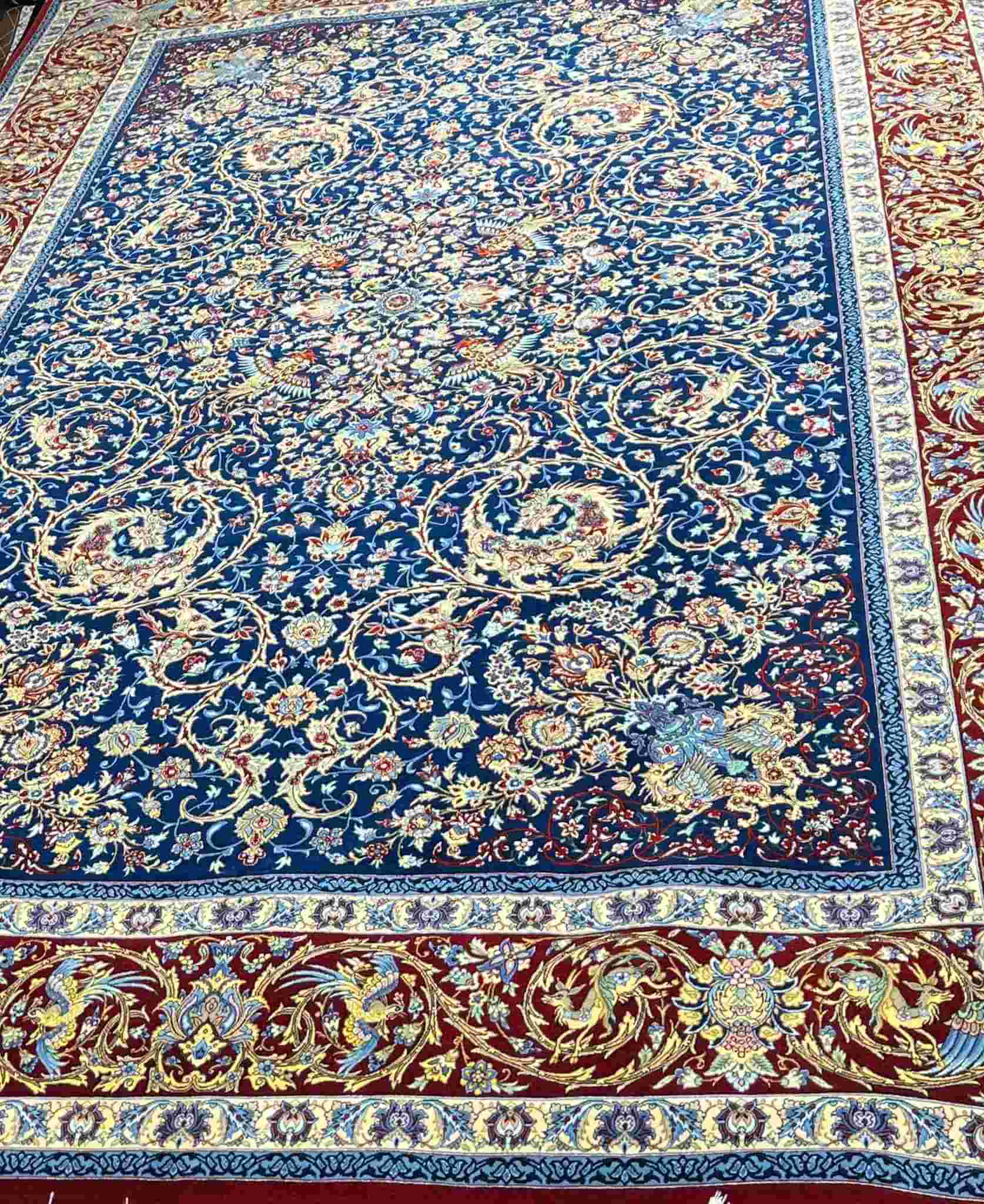 Artisan Persian Area Rug – A hand-knotted, silk-warped rug with traditional Isfahan motifs, offering the perfect blend of vintage style and modern luxury.
