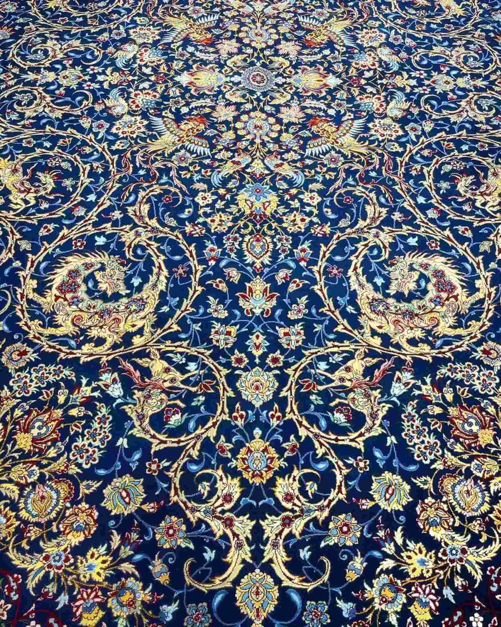 Luxury Silk Hand Knotted Rug – A 10 x 6.7 ft Isfahan rug, handmade with fine silk and wool, adding a touch of sophistication to any living space.
