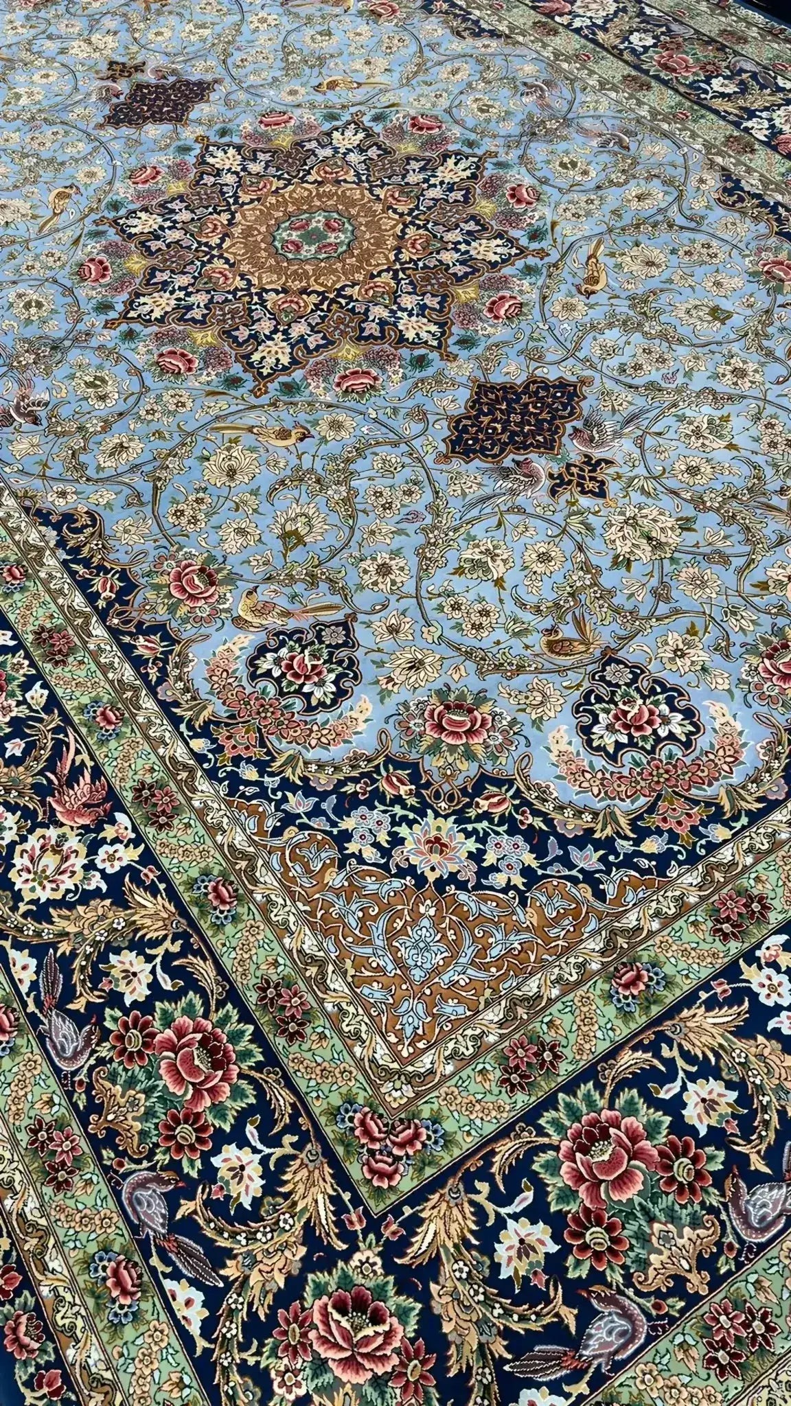 Sophisticated oriental rug in light blue with green and red accents enhancing home decor