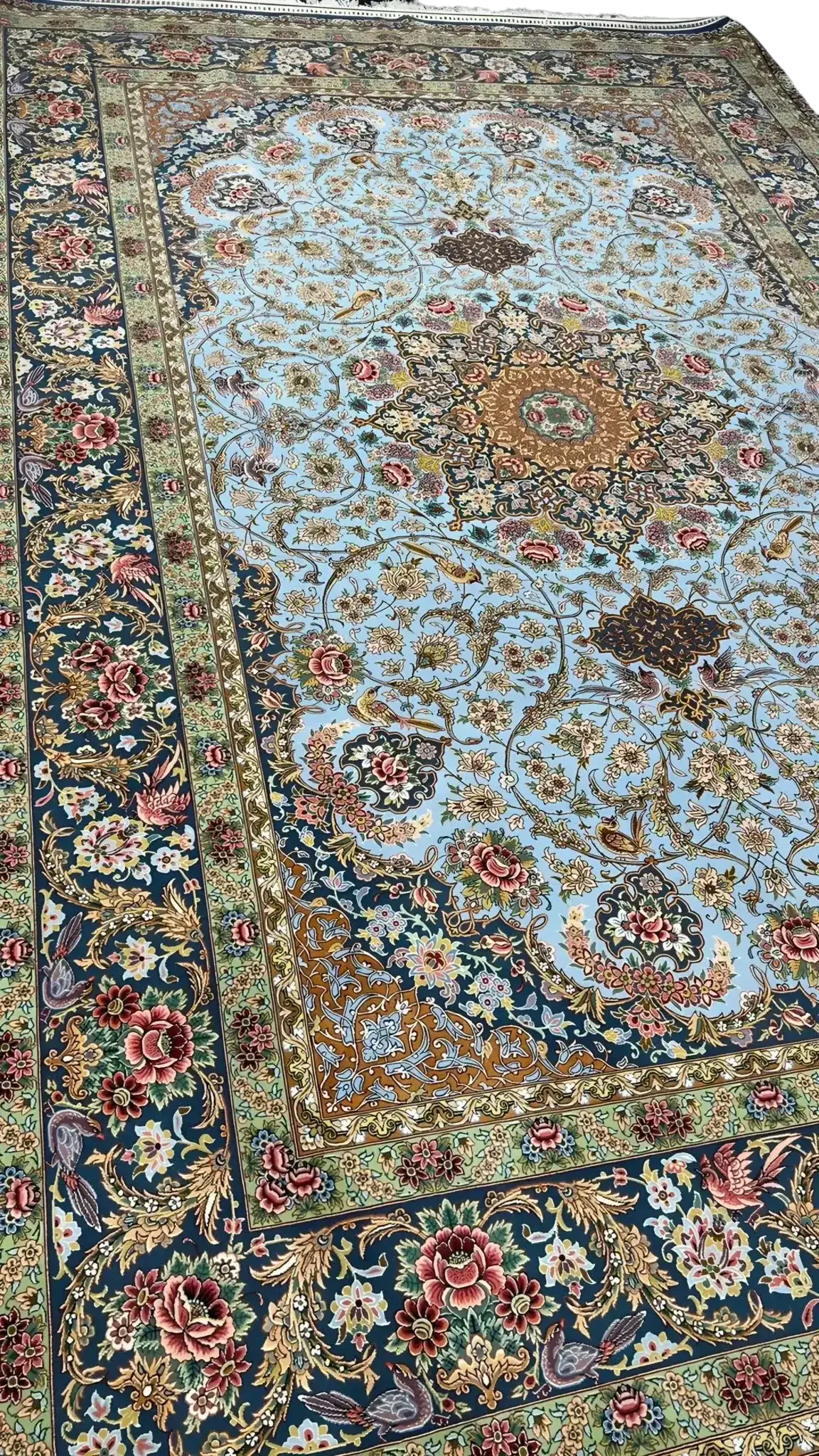 Elegant silk carpet featuring blue and green oriental motifs