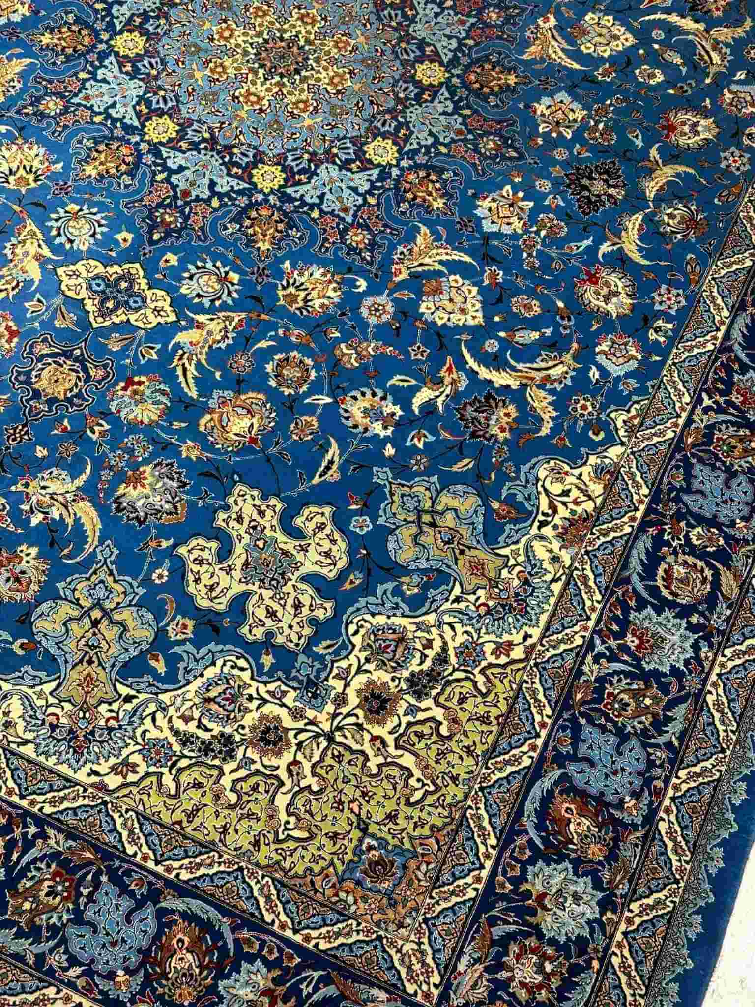 Isfahan Silk Persian Rug – A beautiful wool and silk blend Persian rug from Isfahan, hand-knotted by Mirzaie, perfect for adding a luxurious touch to any room.
