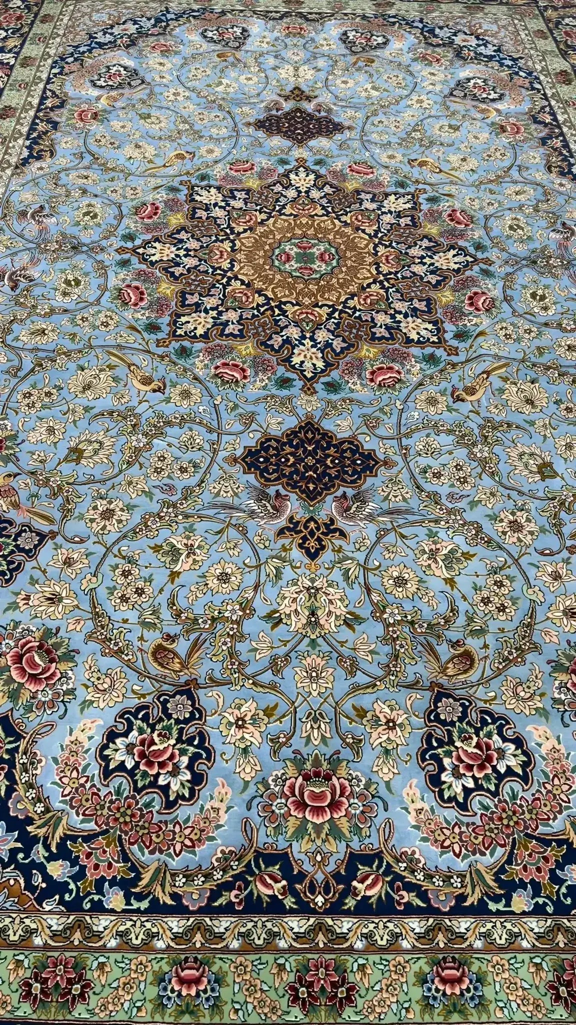 Luxurious light blue silk floor carpet with oriental design elements