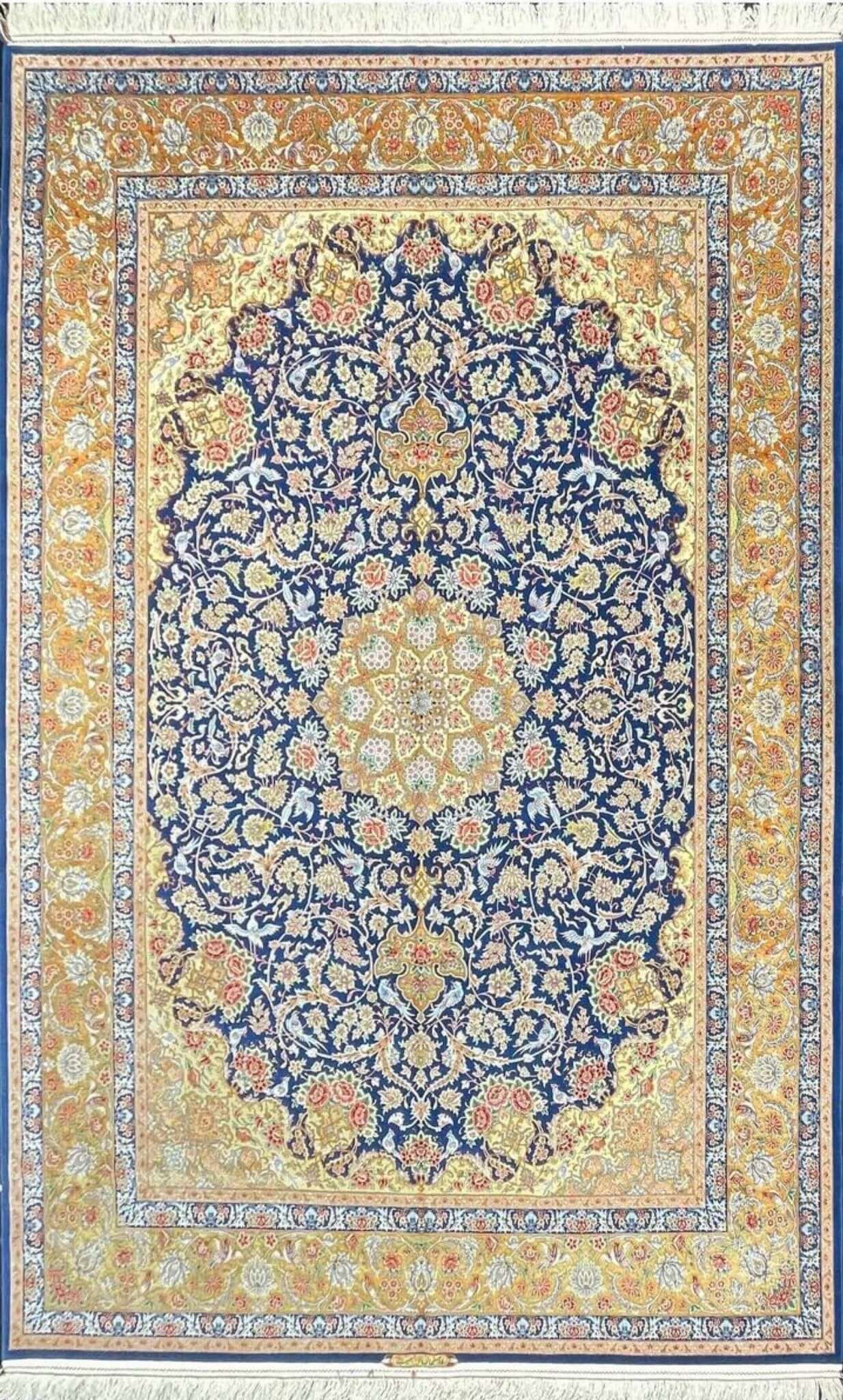 "Luxurious handmade blue Persian rug from Isfahan, Iran, crafted with silk and wool."

