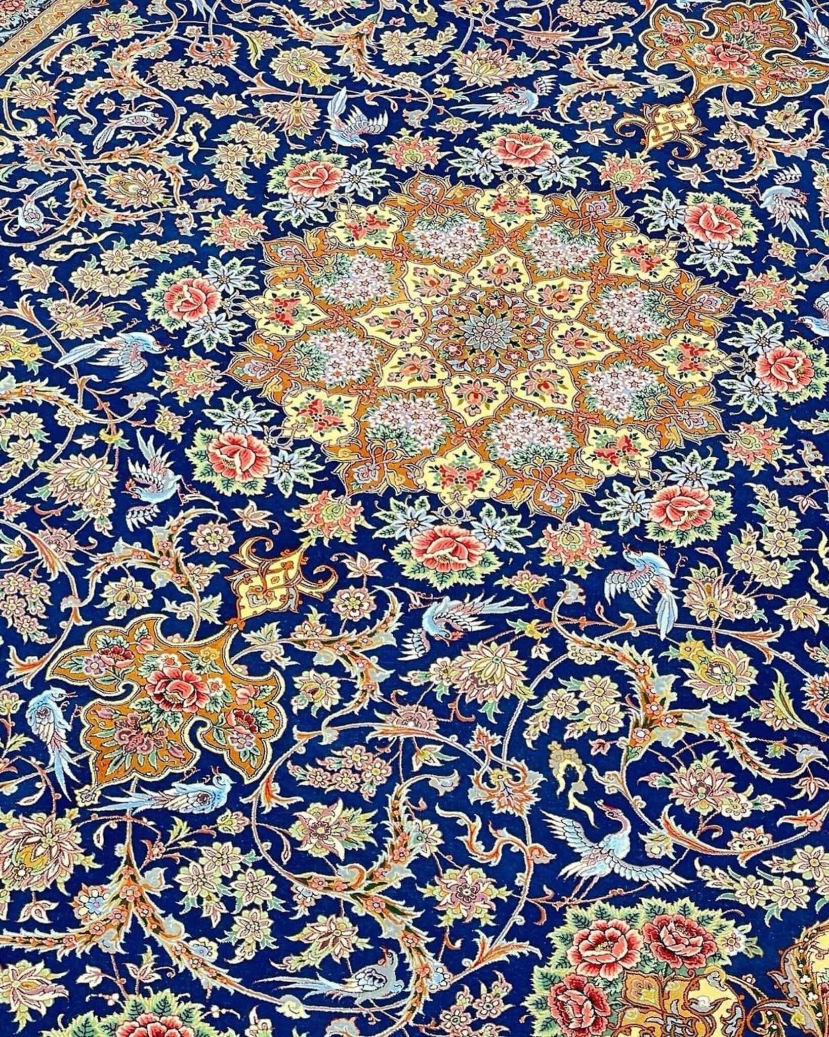 "Authentic Isfahan Persian rug, navy blue with traditional designs, made from wool and silk."
